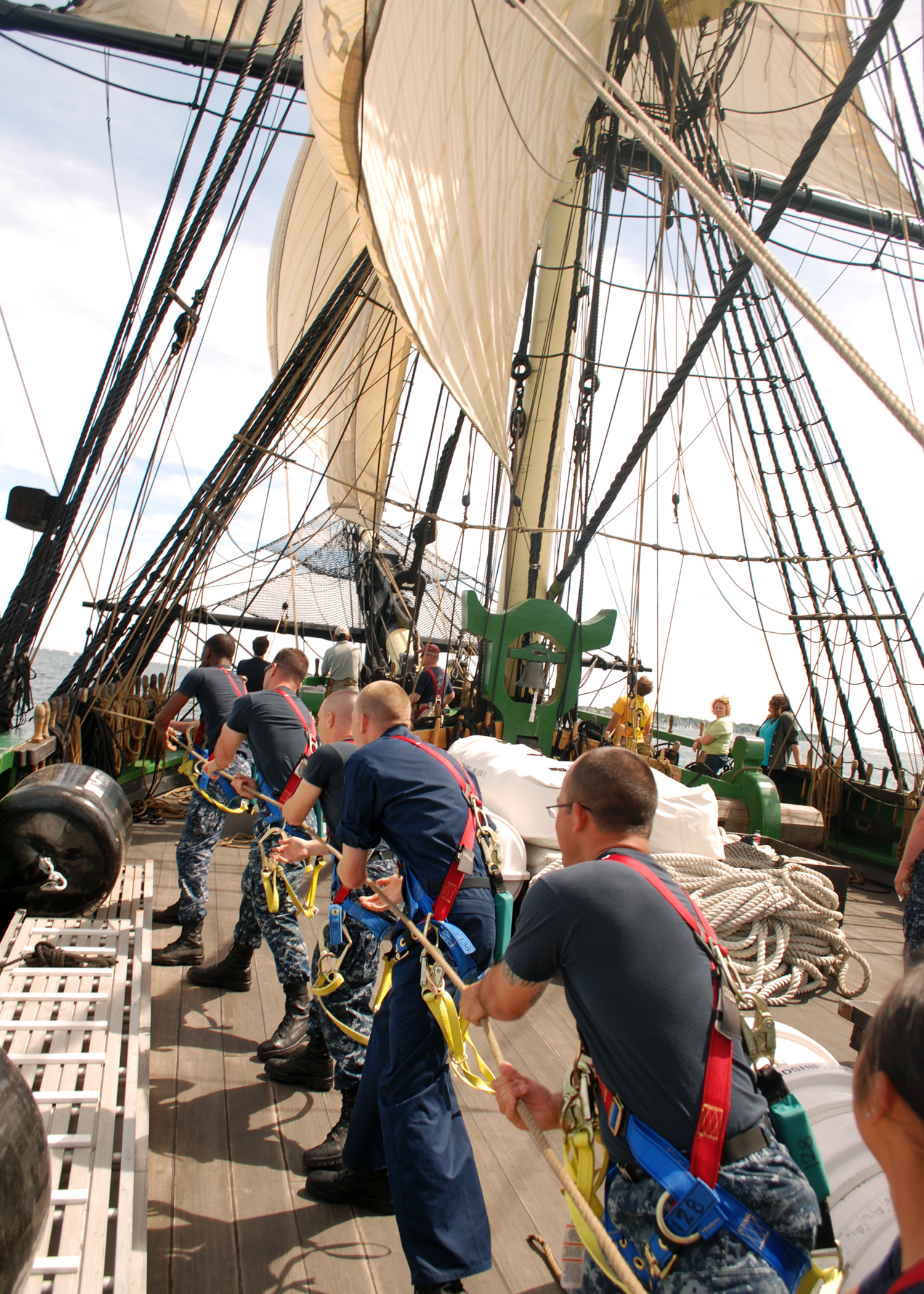 US Navy 110619-N-AU127-377 Sailors assigned to USS Constitution heave a line during sail training aboard Friendship of Salem.jpg