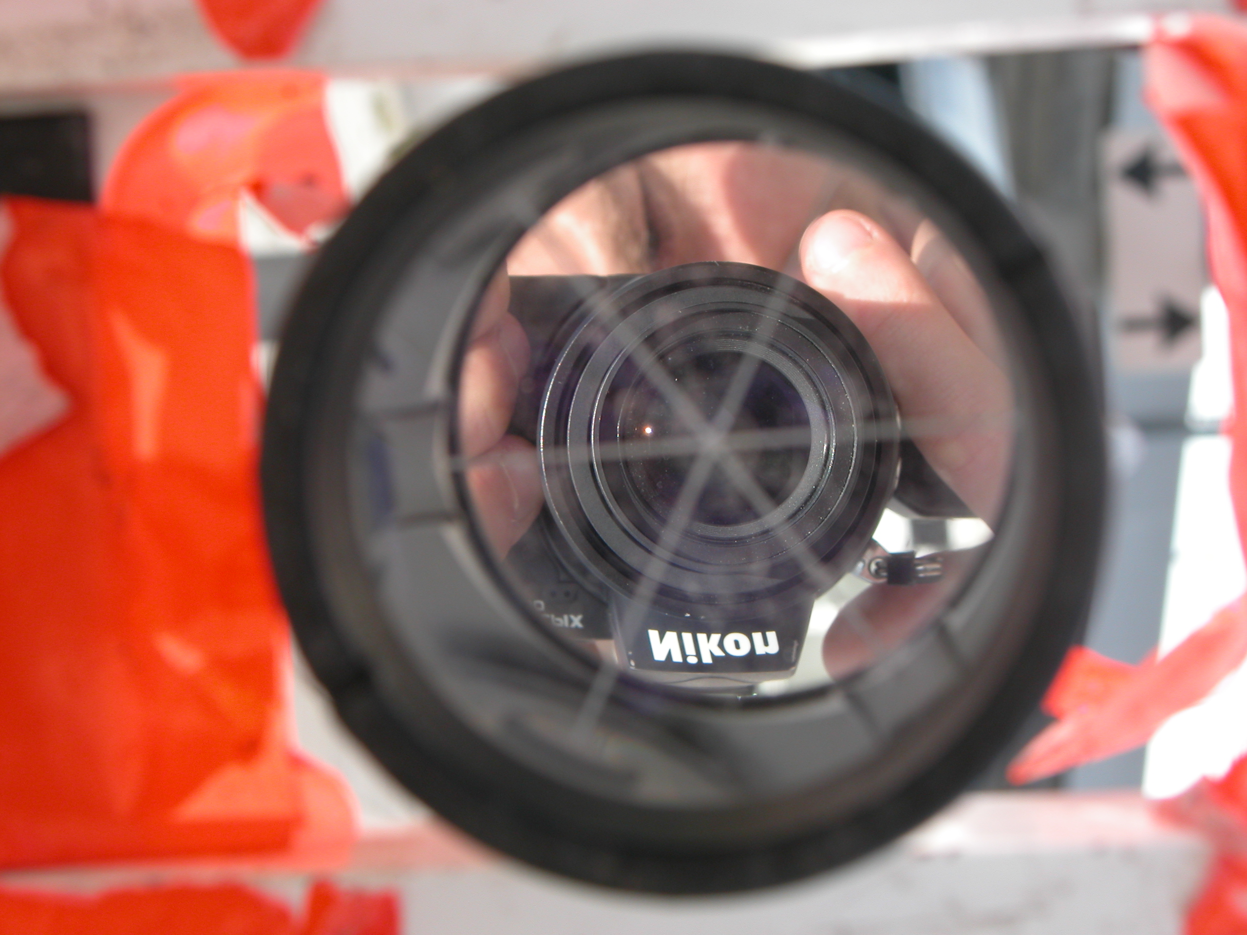 nikon camera in reflection in mirror