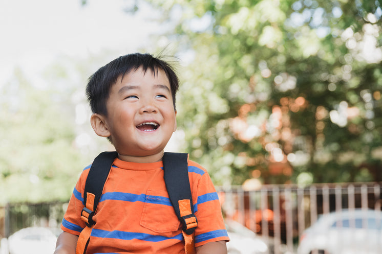 School Child Giggles In The Sun