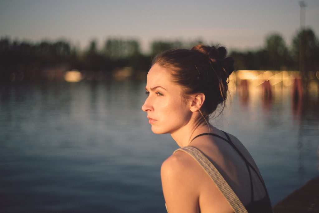 Pensive girl at the lake - free stock photo