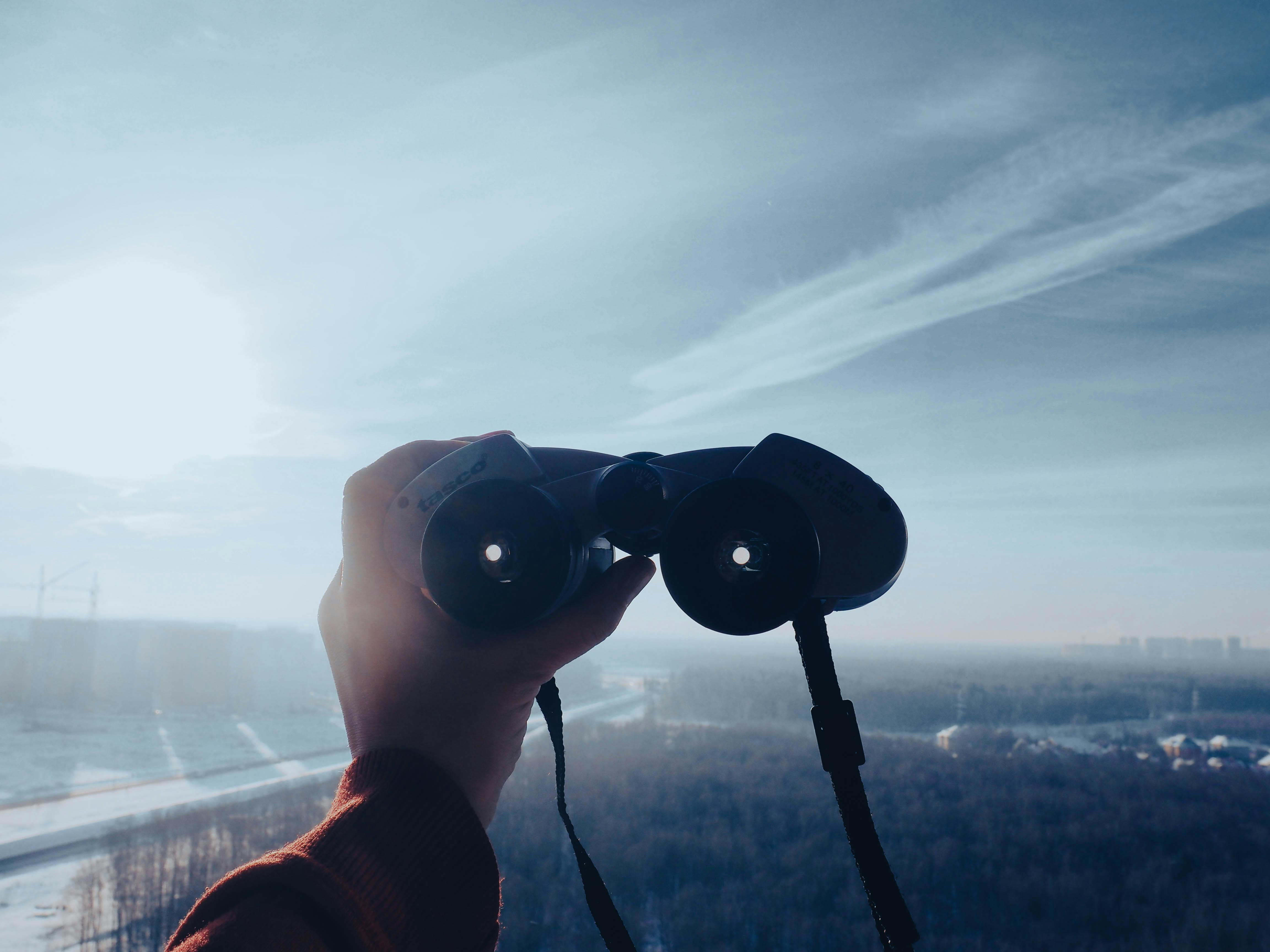 a person holding binoculars