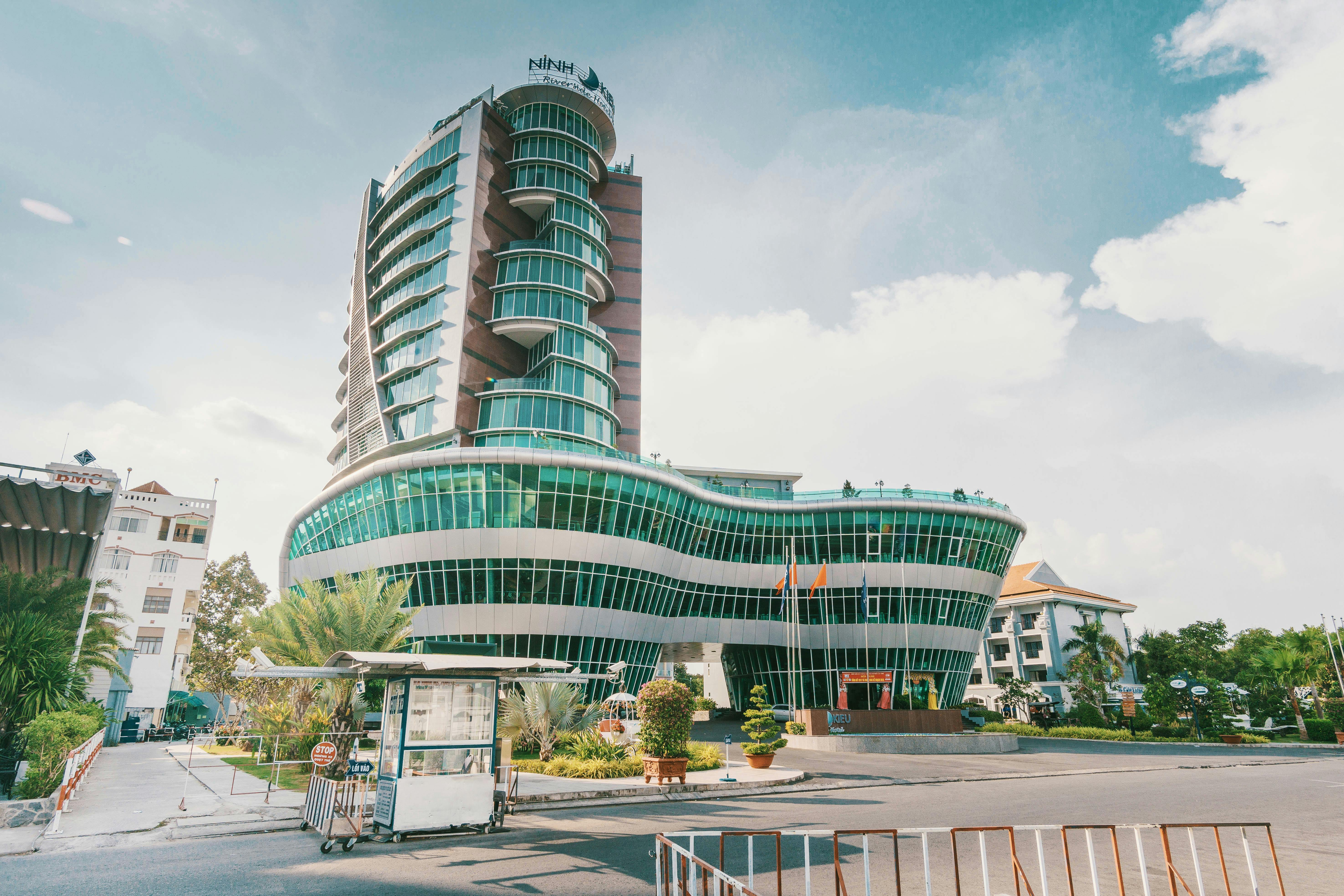 high rise building with green glass windows