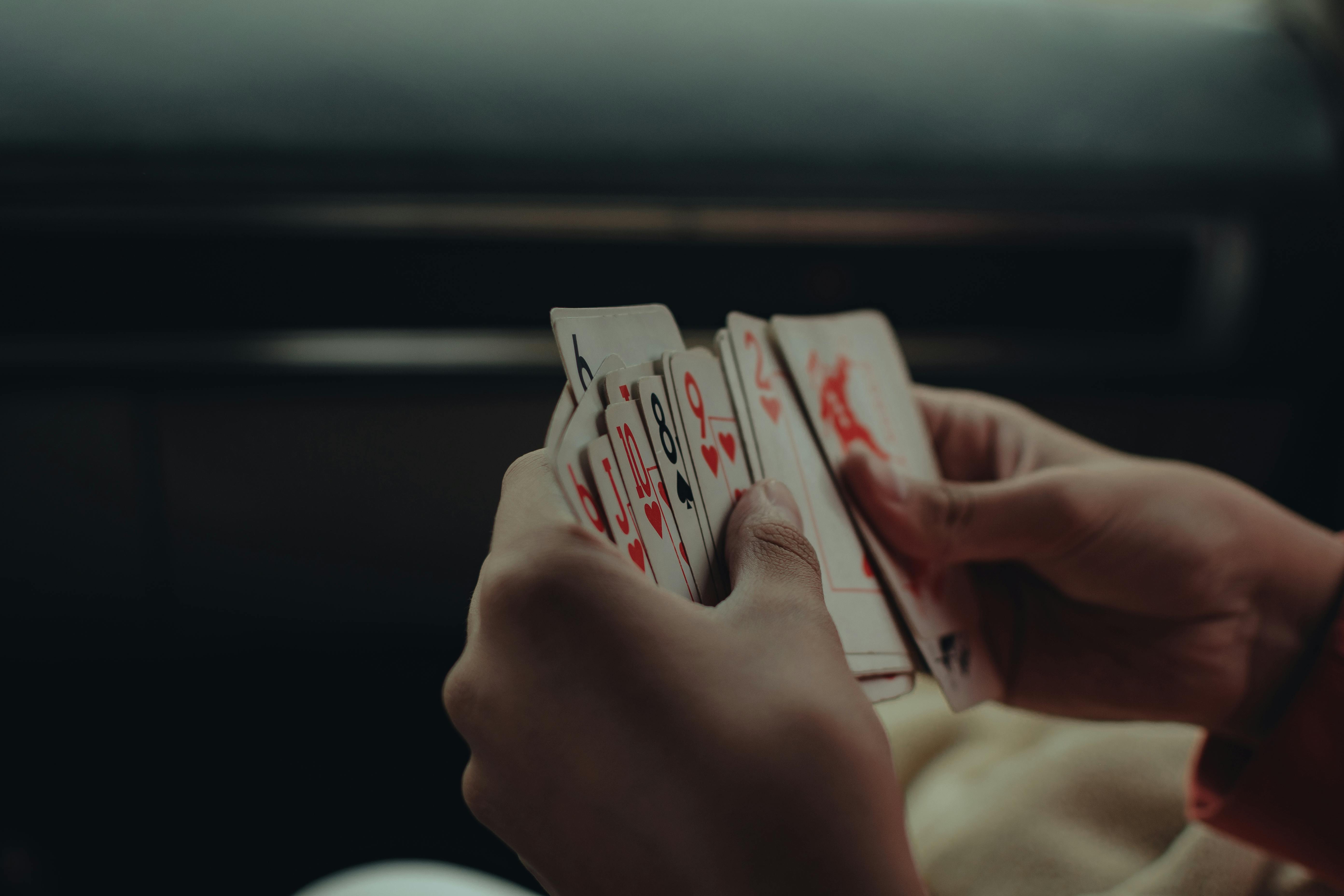 hands holding cards