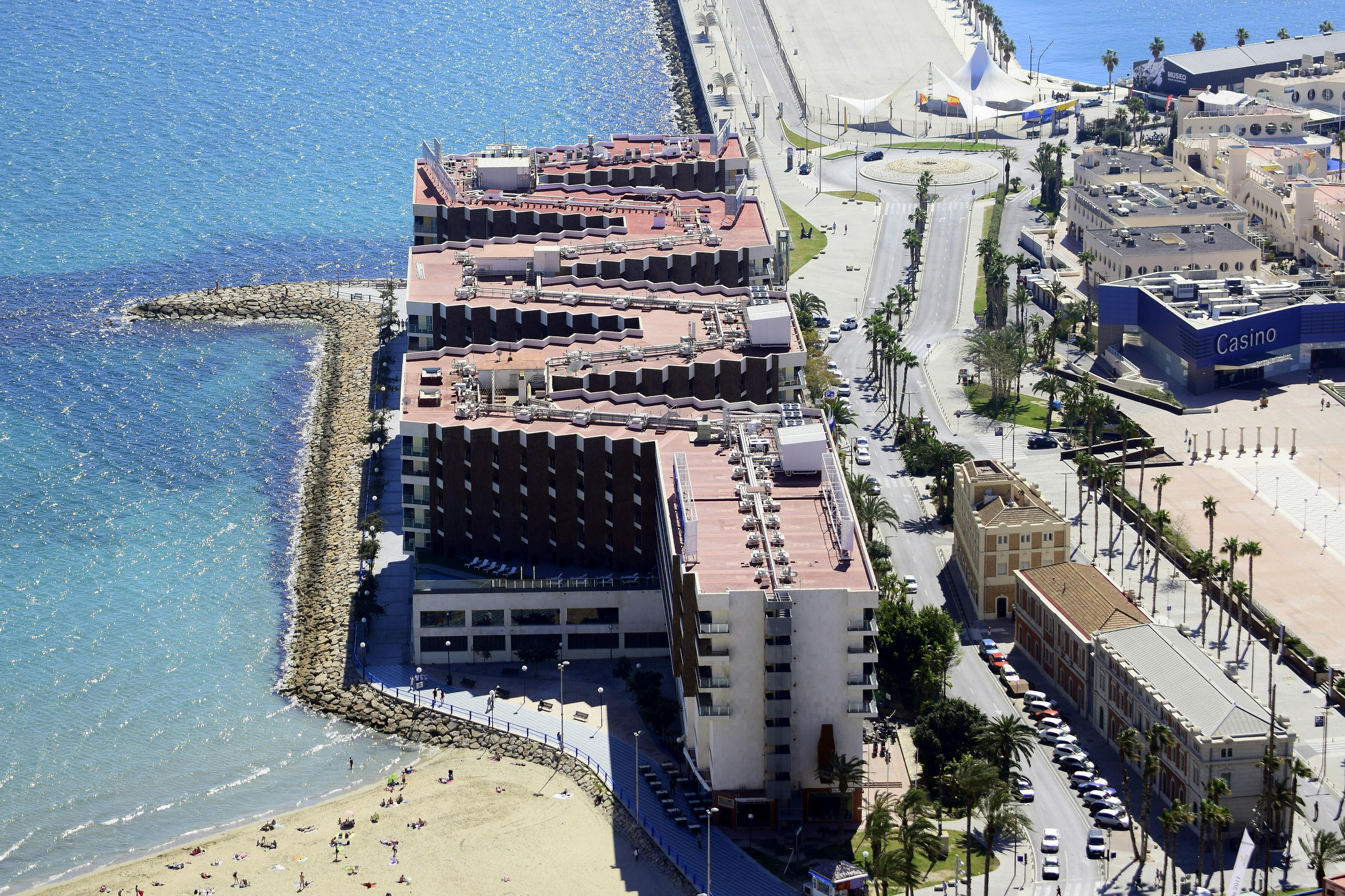 aerial view of city buildings near body of water