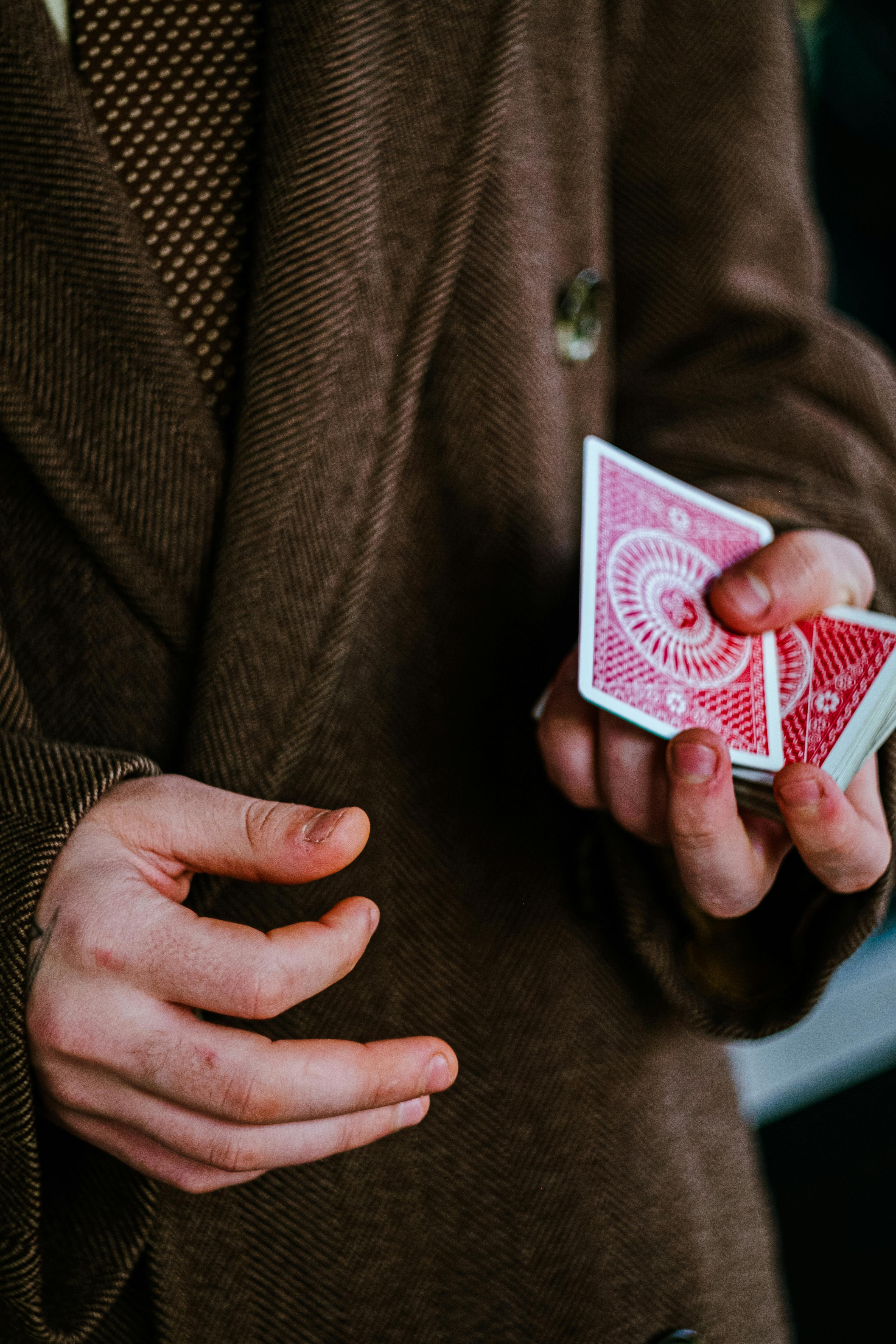 person holding playing card