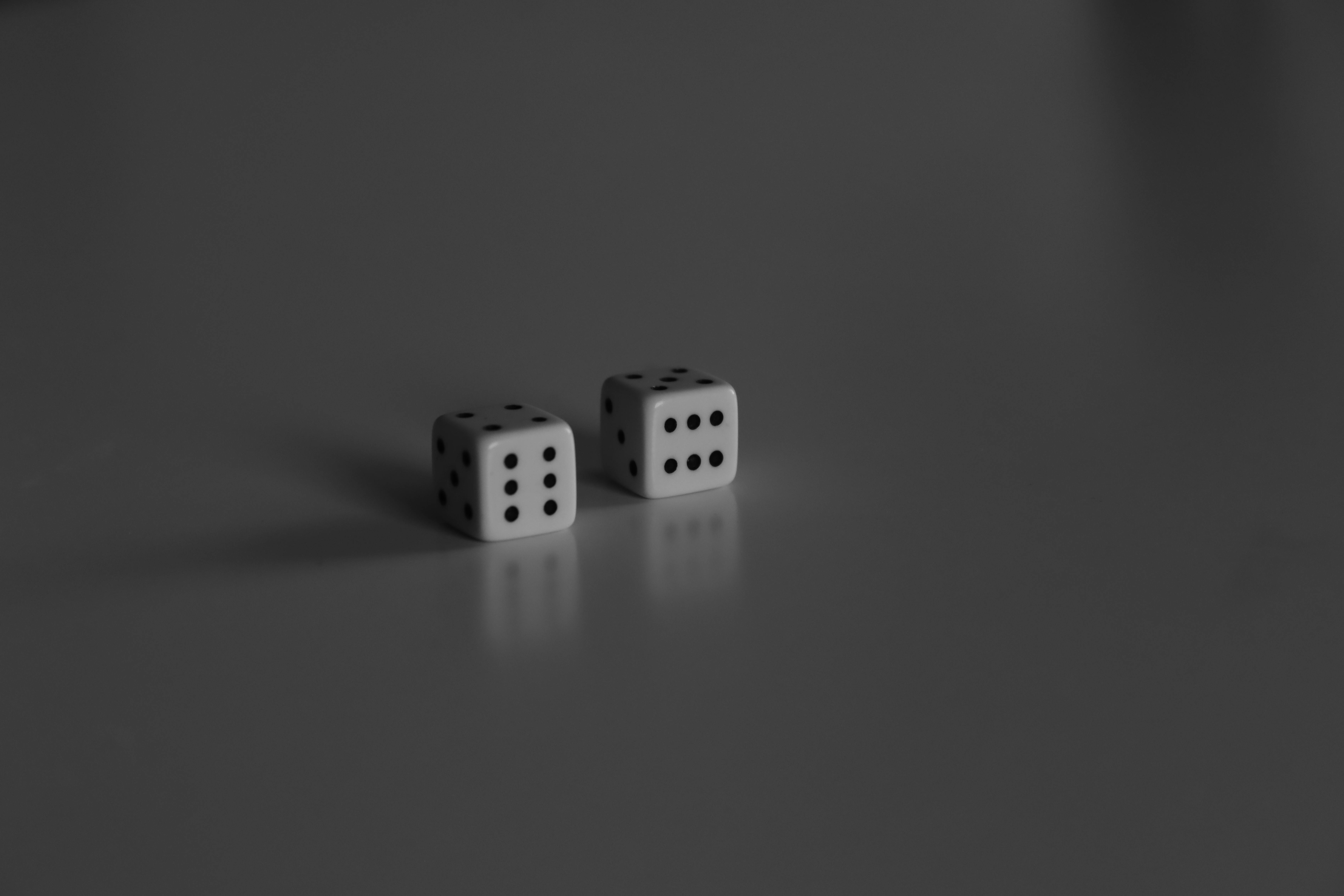 two dice on a gray surface