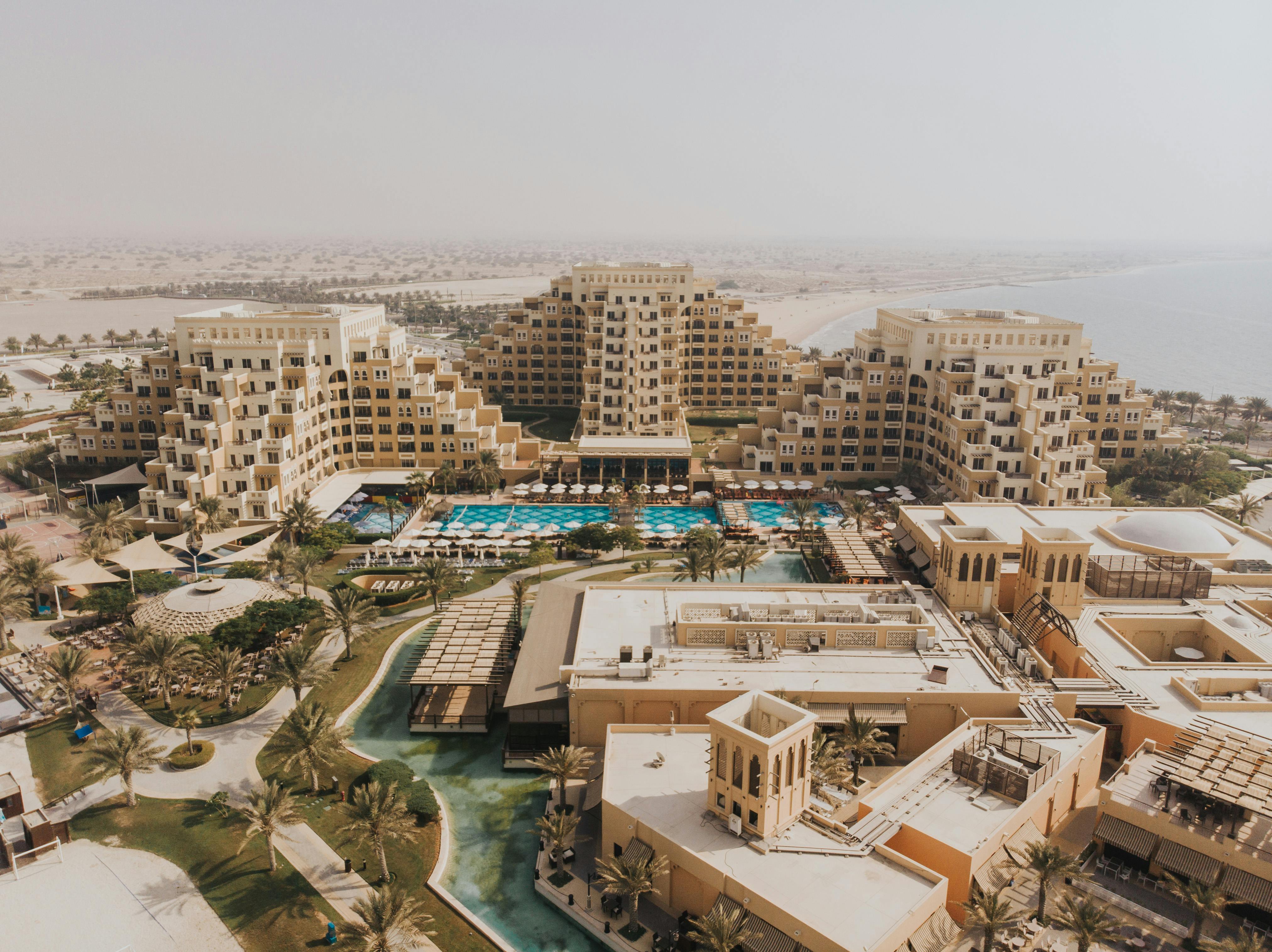 the aerial view of the hotel and resort in dubai