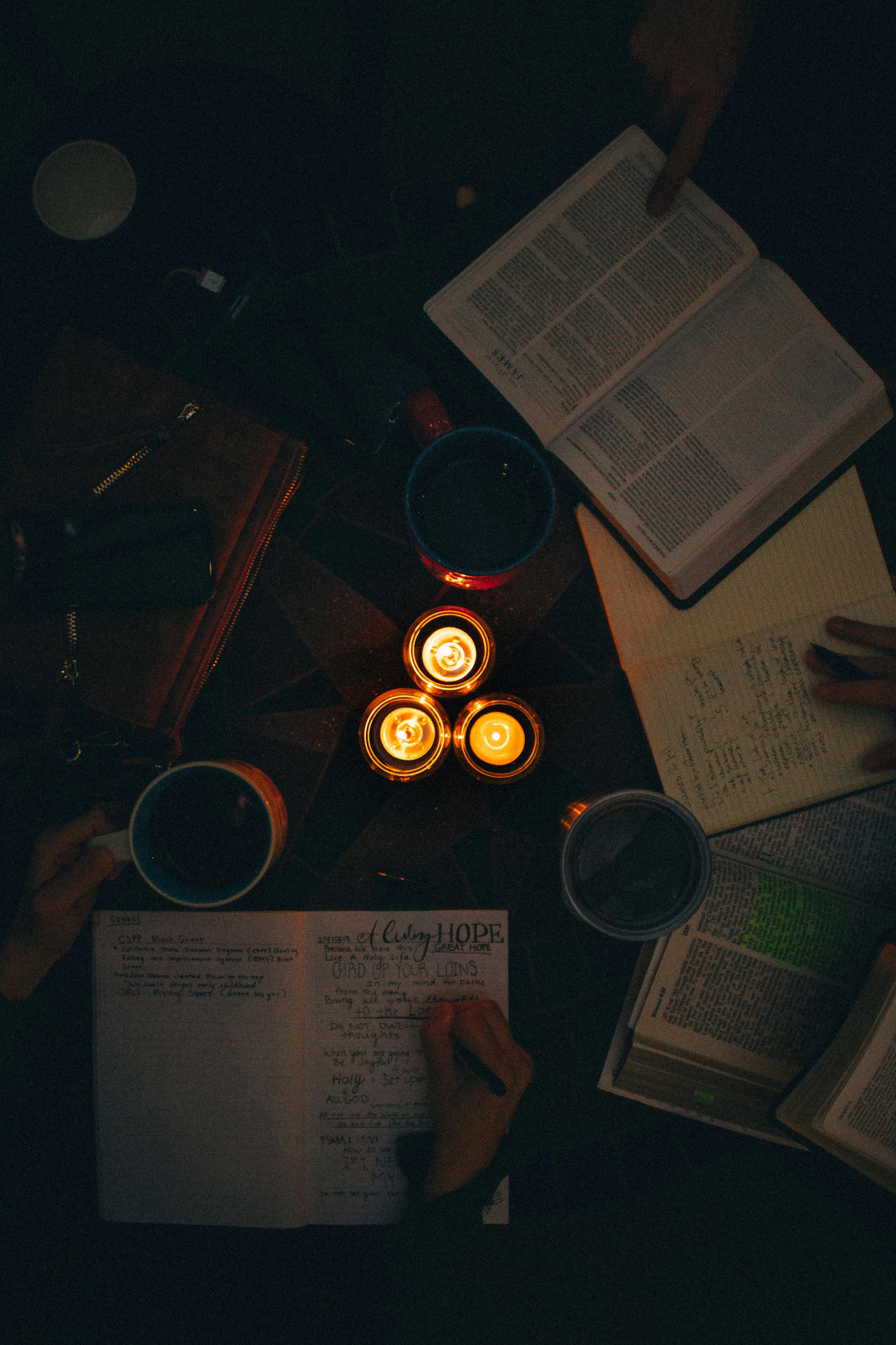 top view photo of people writing on notebook