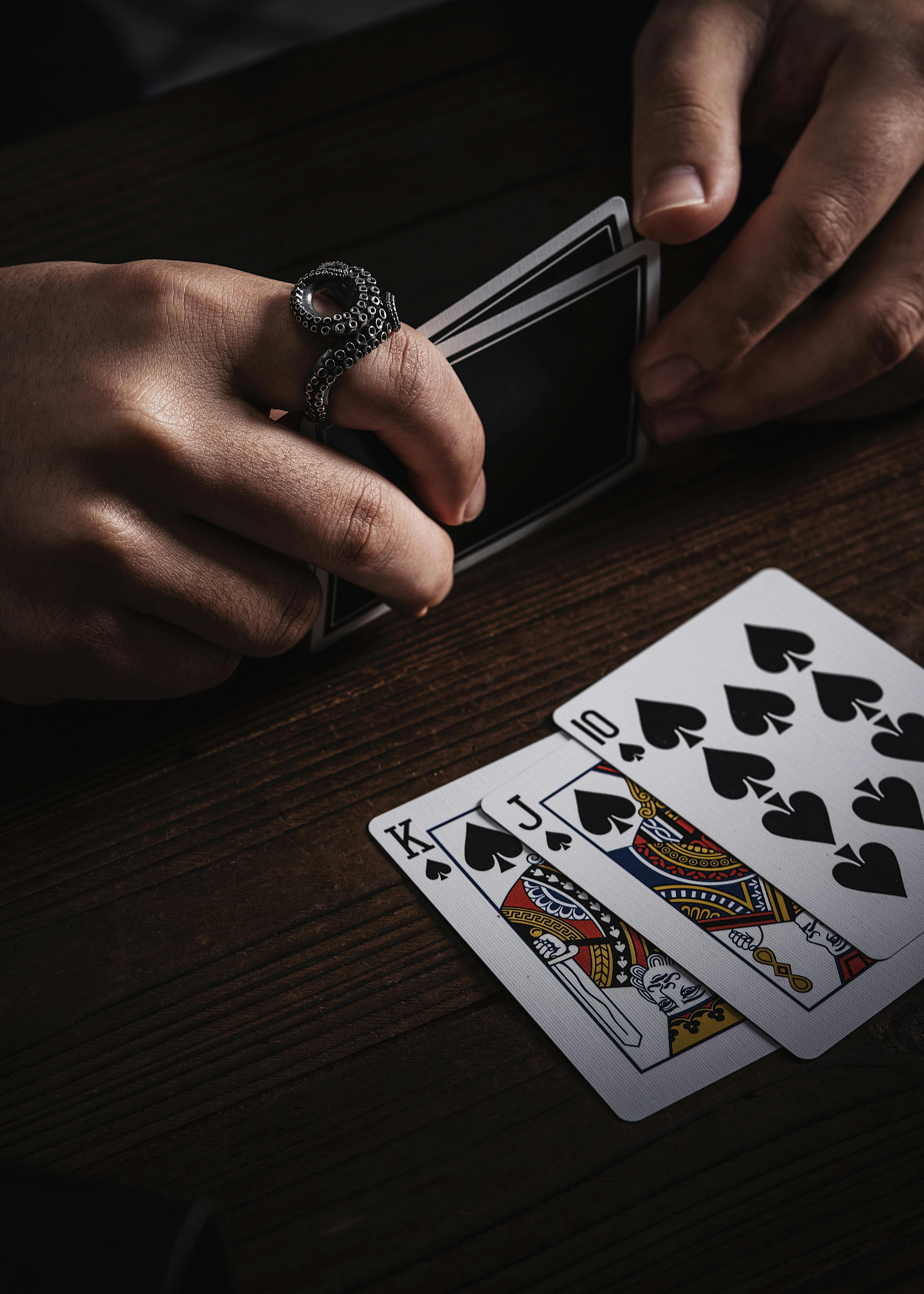 man with octopus ring with cards