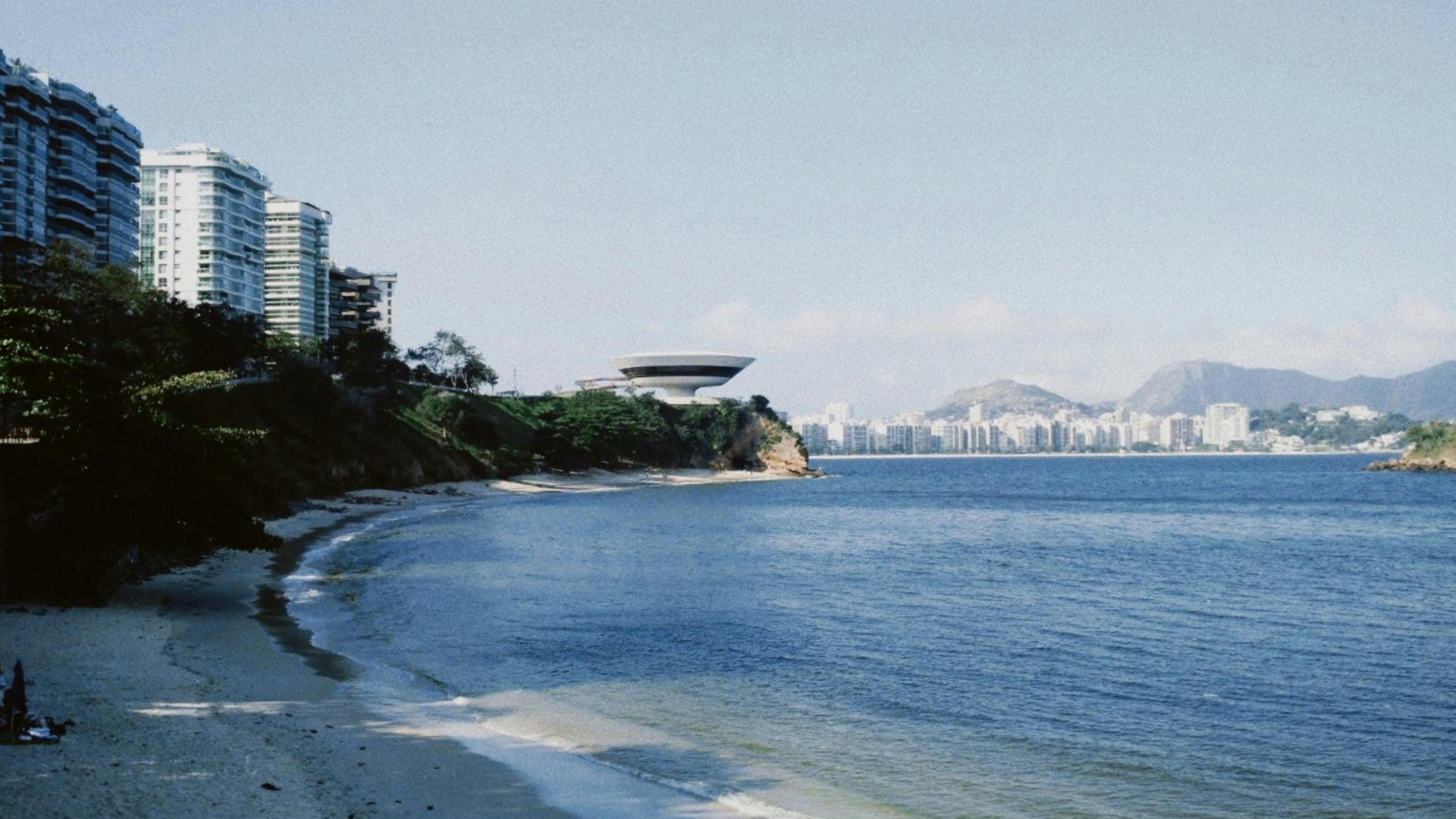 buildings on seashore near sea