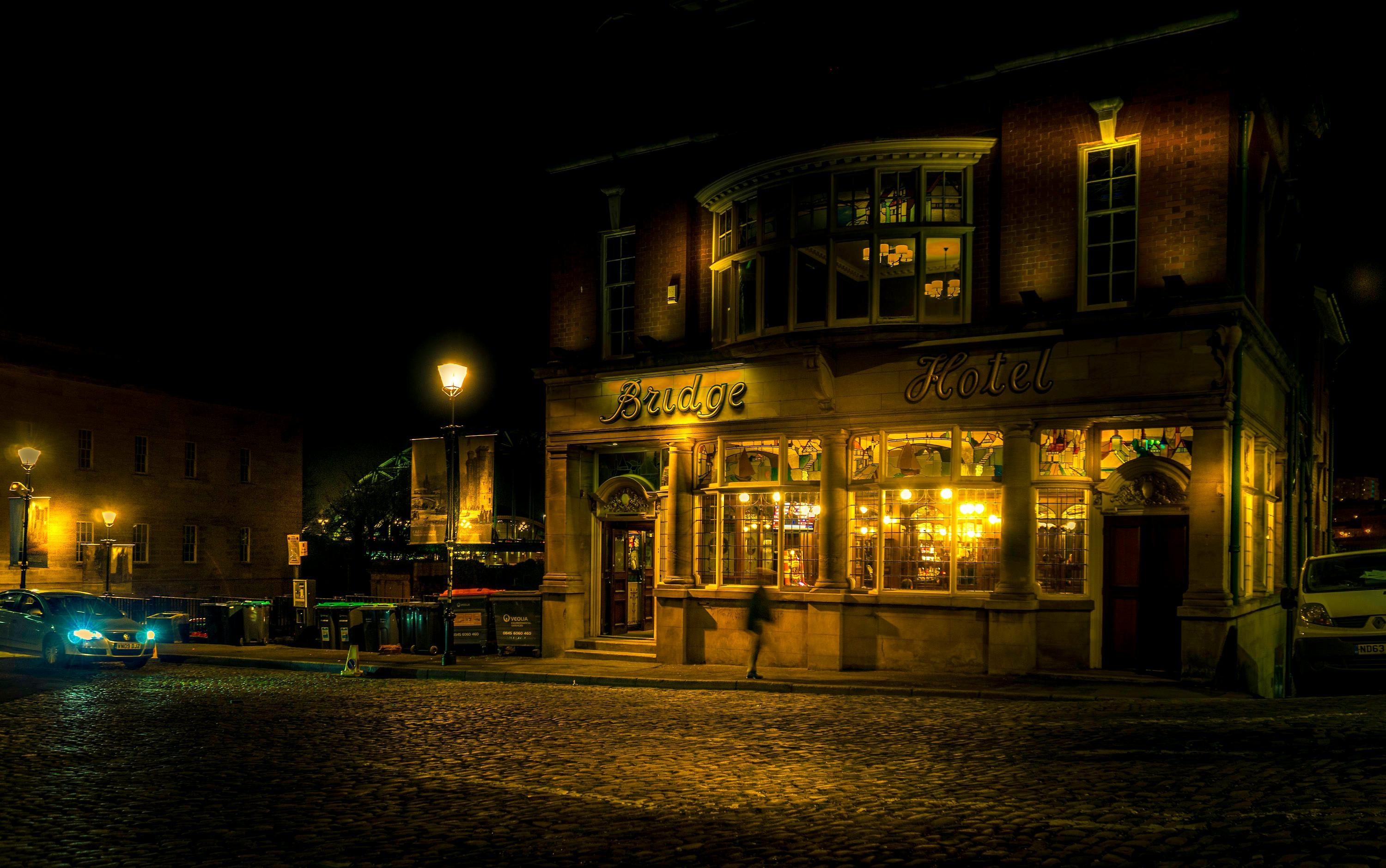 brown building with yellow lights at night