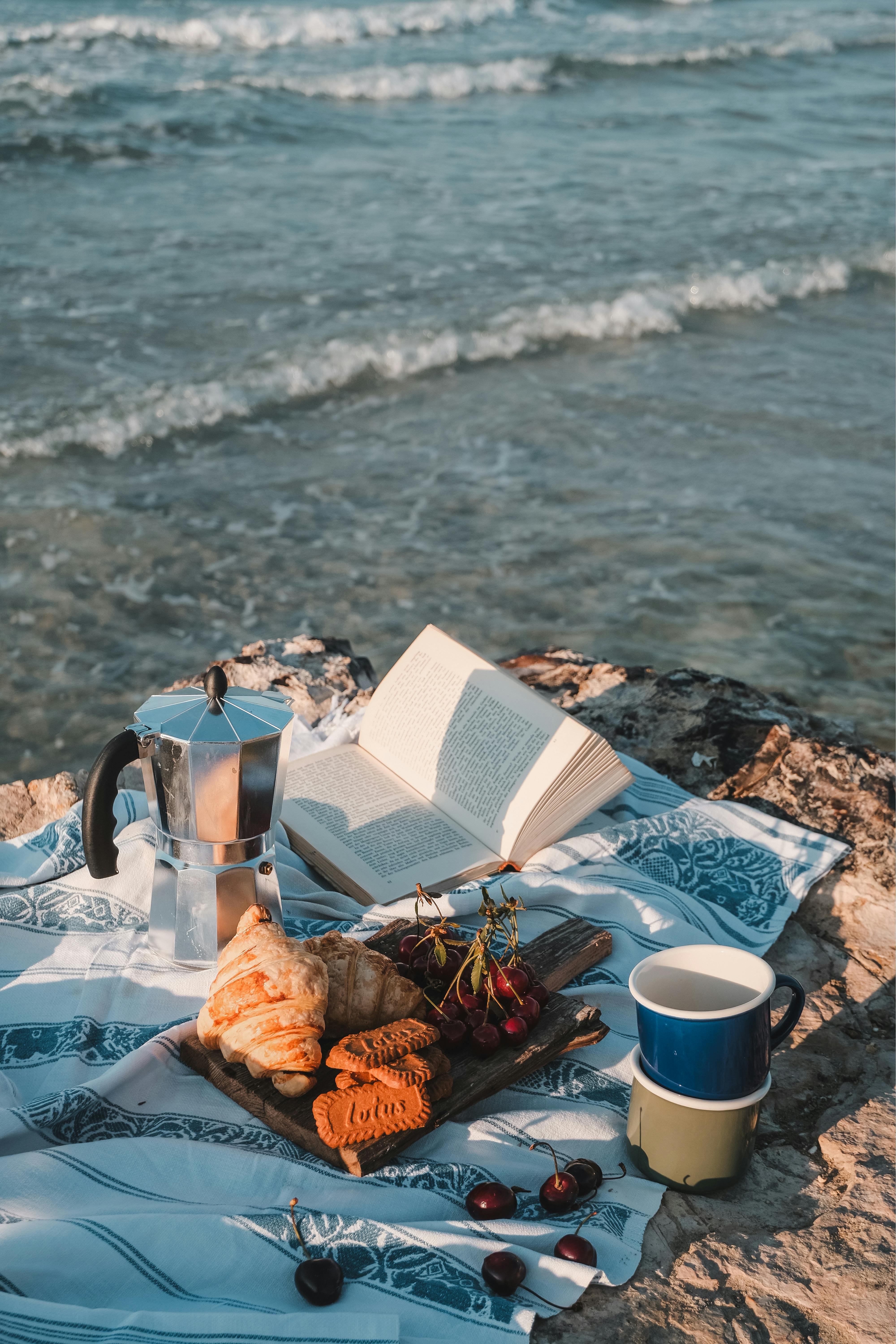 picnic on the beach and sea waves in the distance