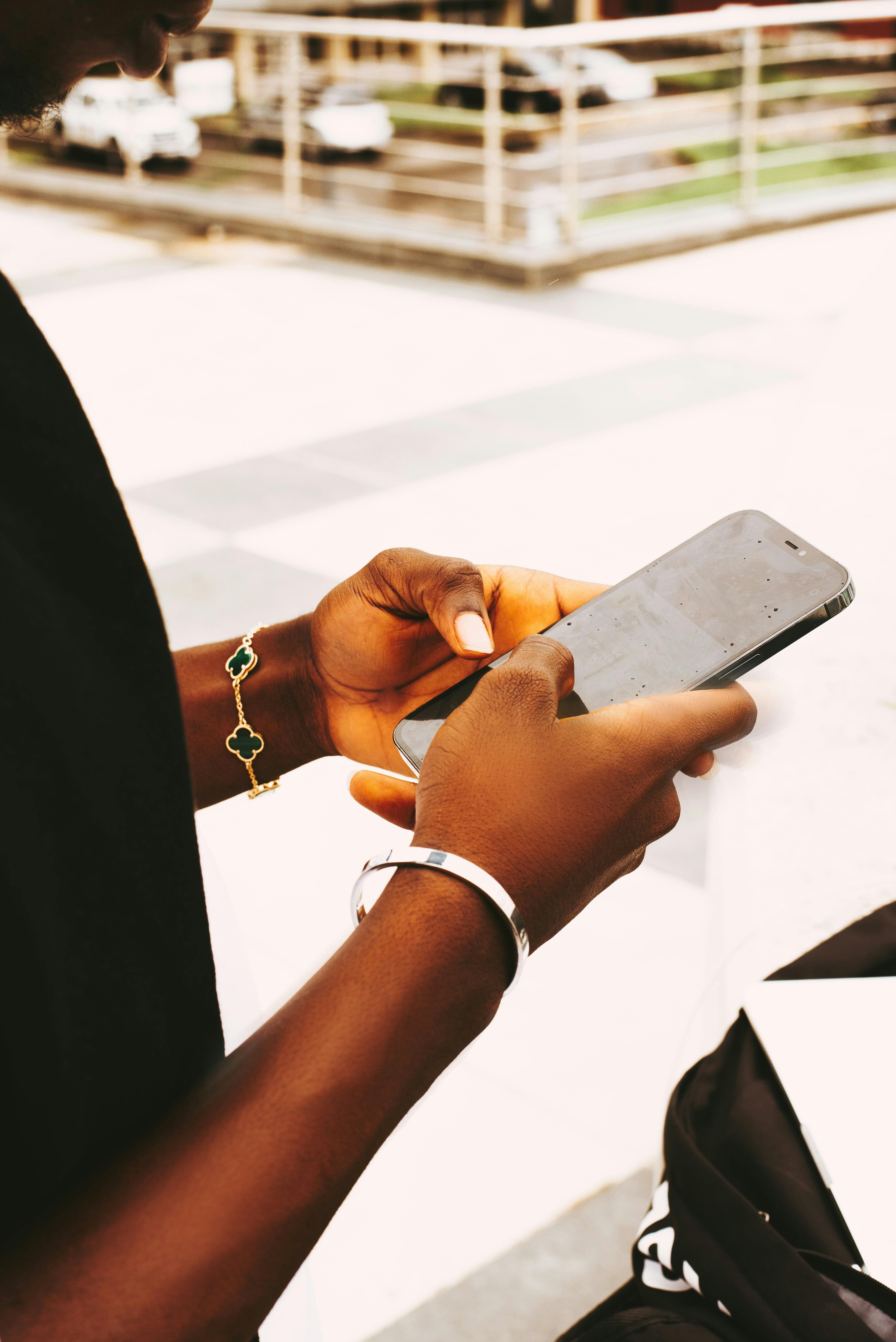 man holding a smart phone with both hands