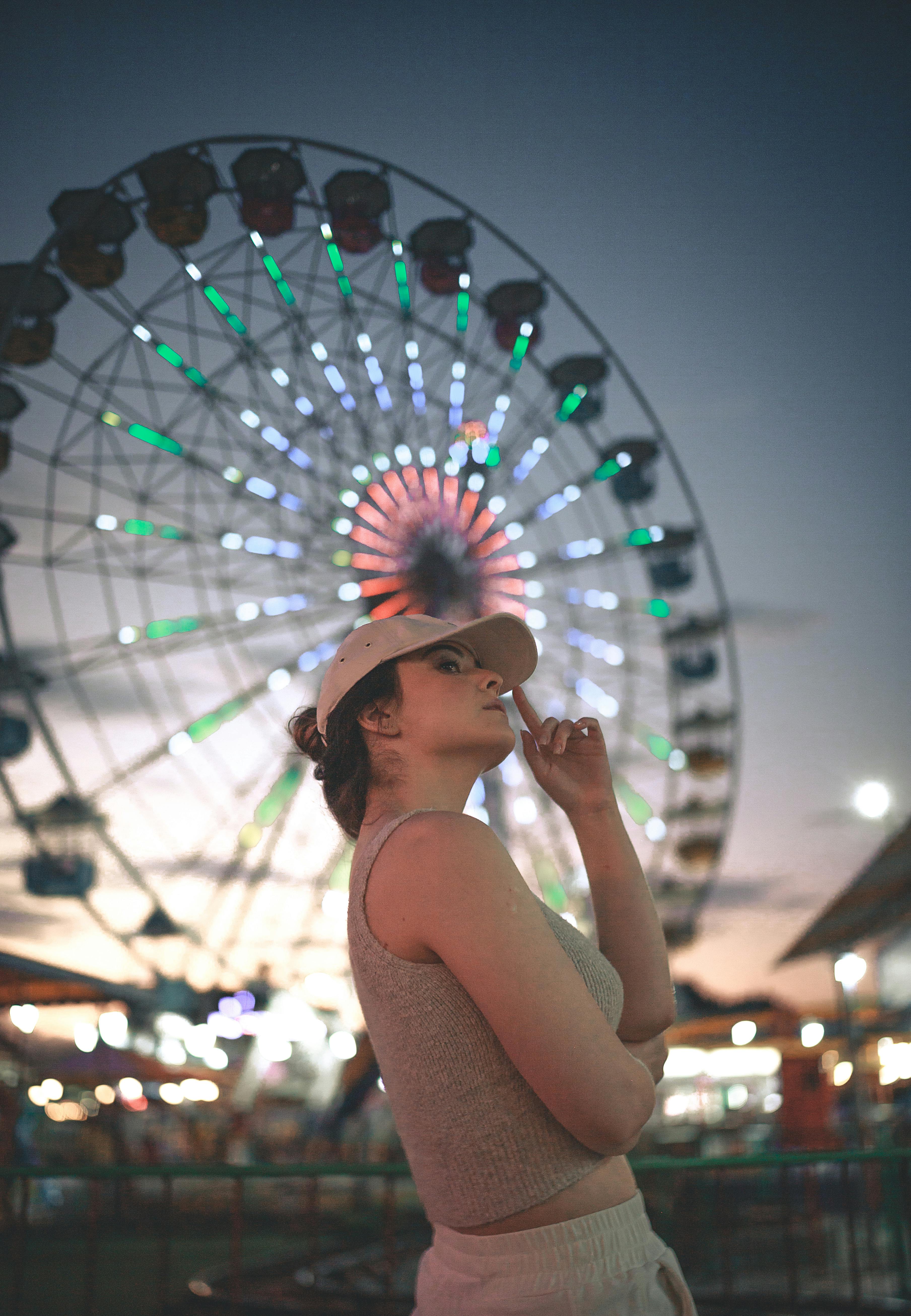 woman in funfair at dawn