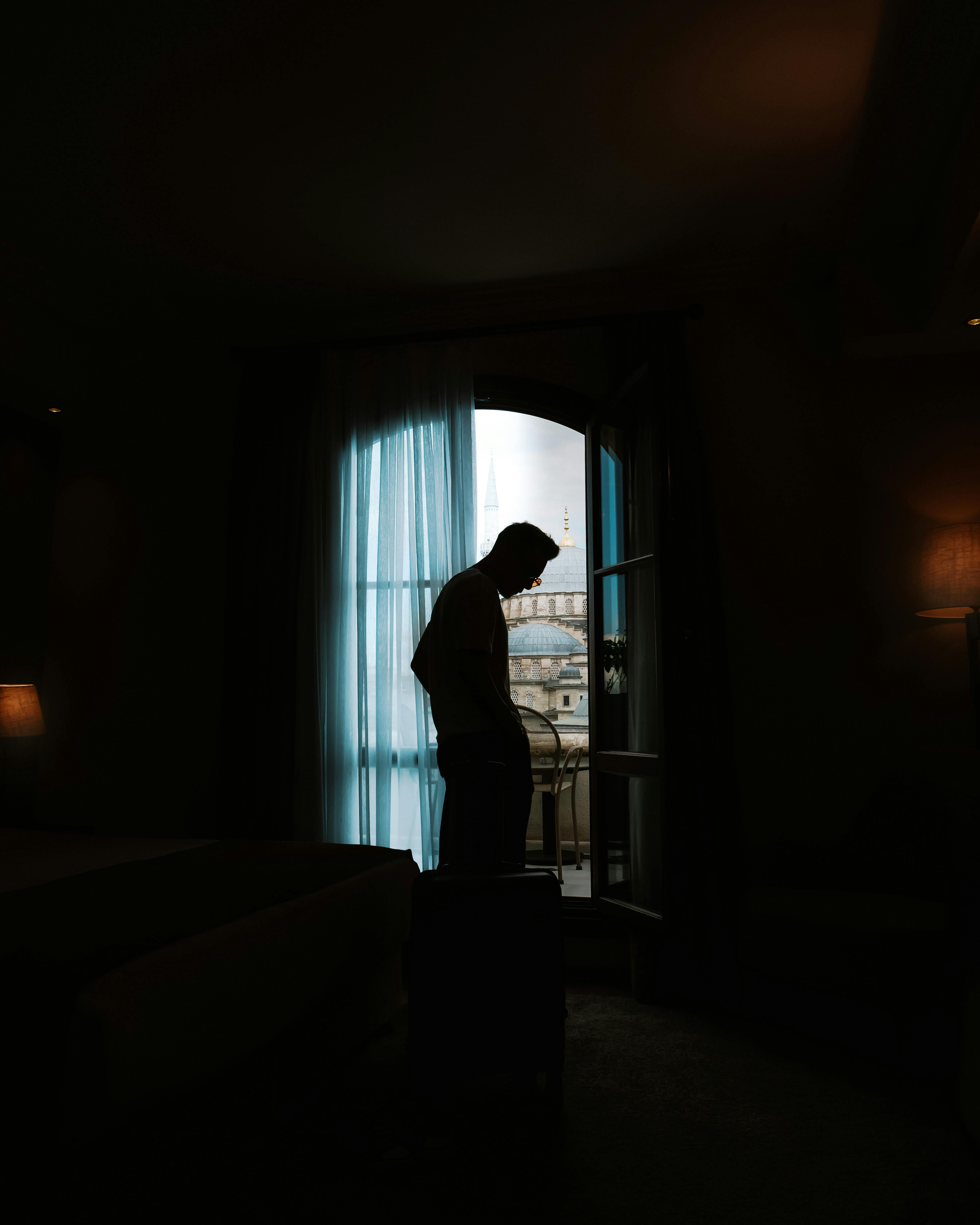 man standing in darkness in room in istanbul