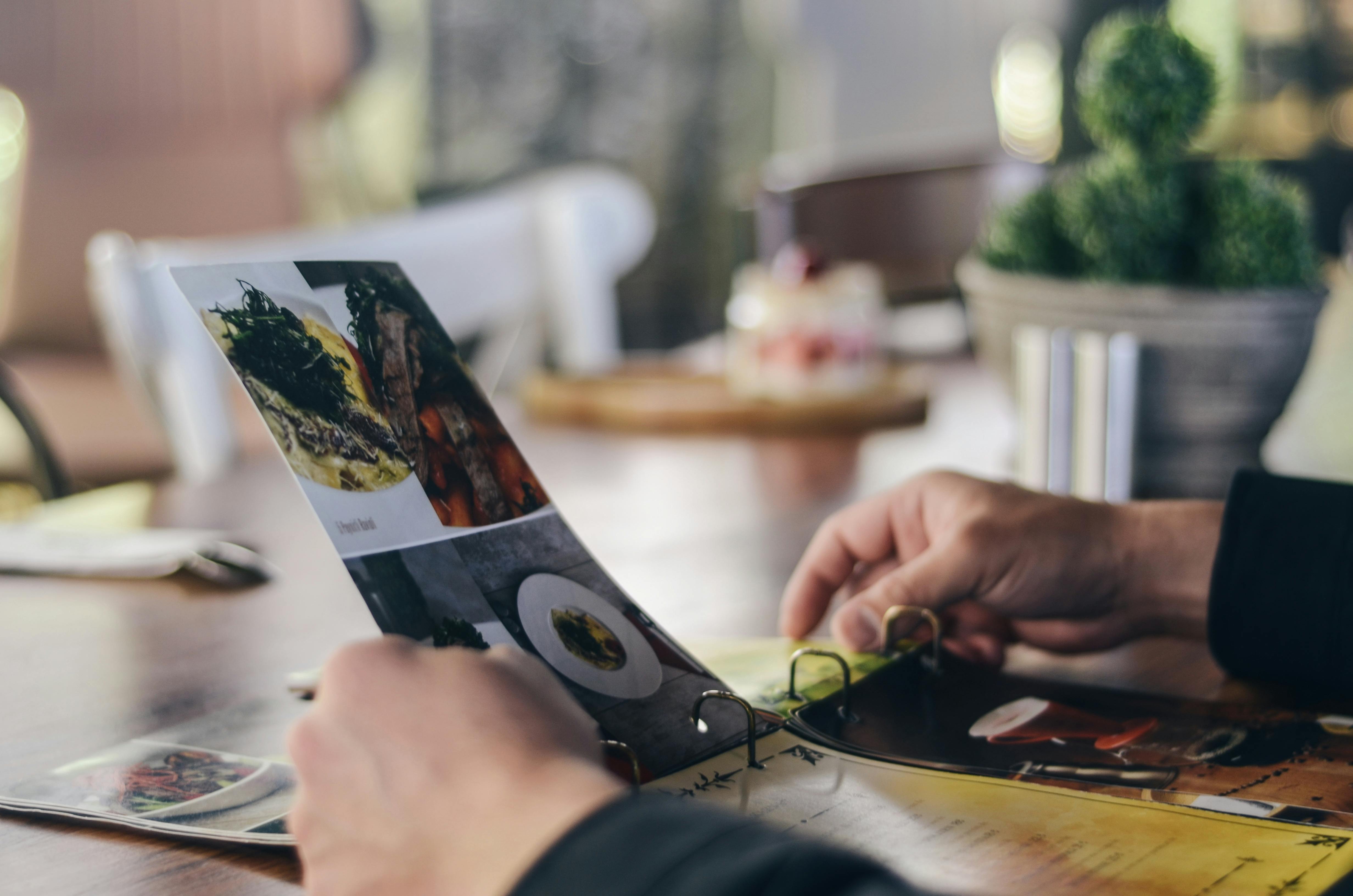 person holding magazine