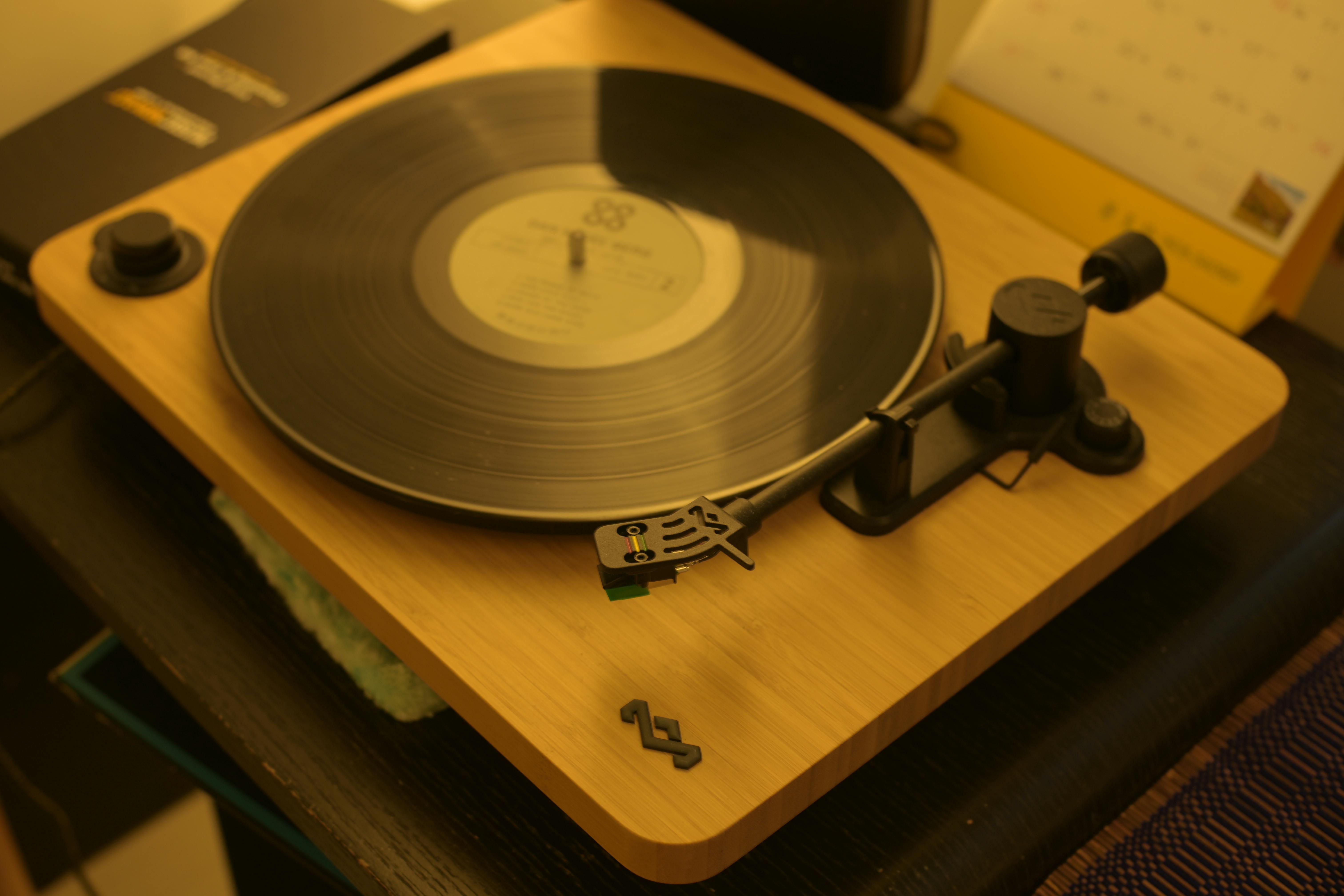 vintage turntable with vinyl record spinning