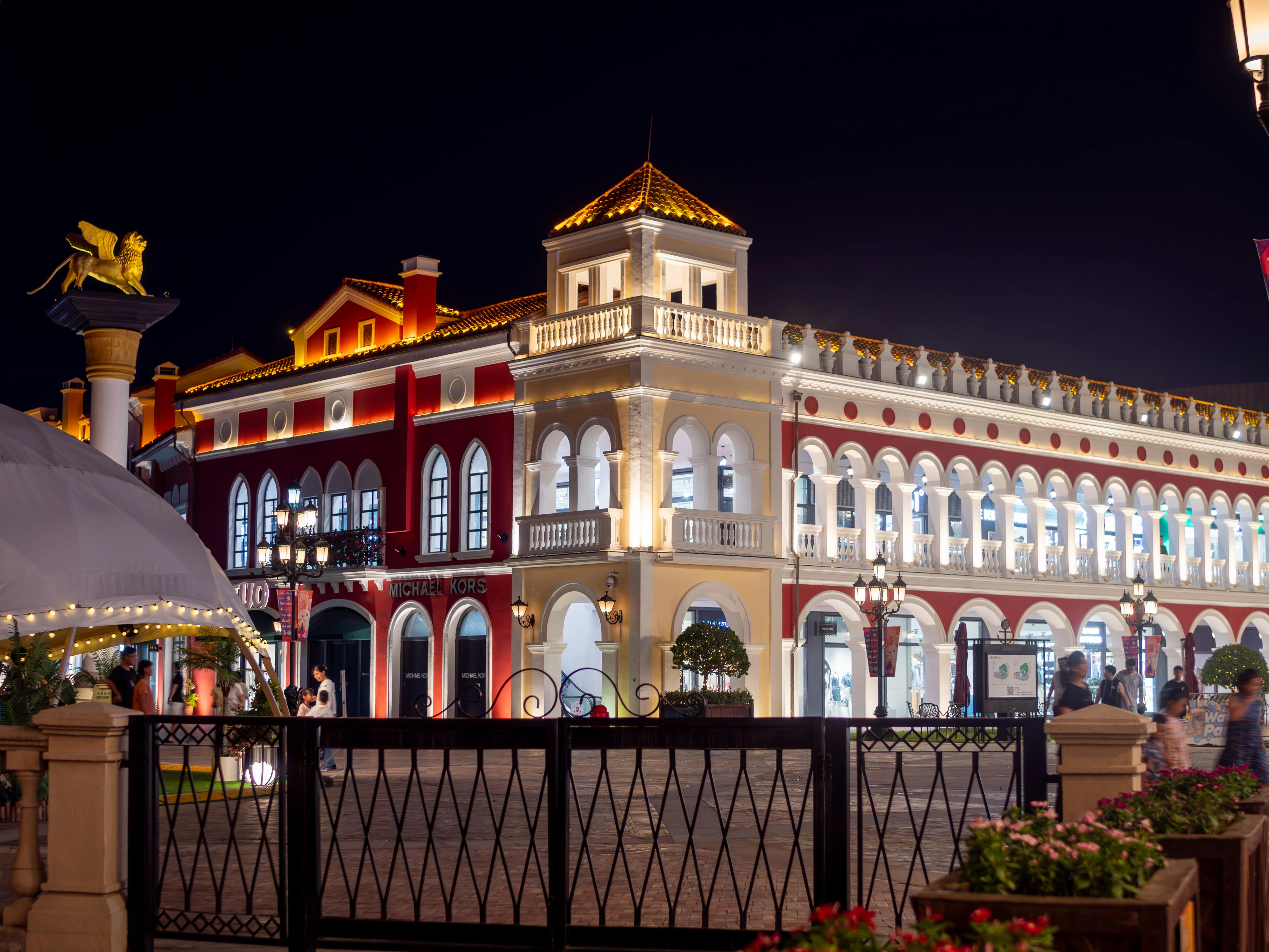 a large building with a clock tower at night