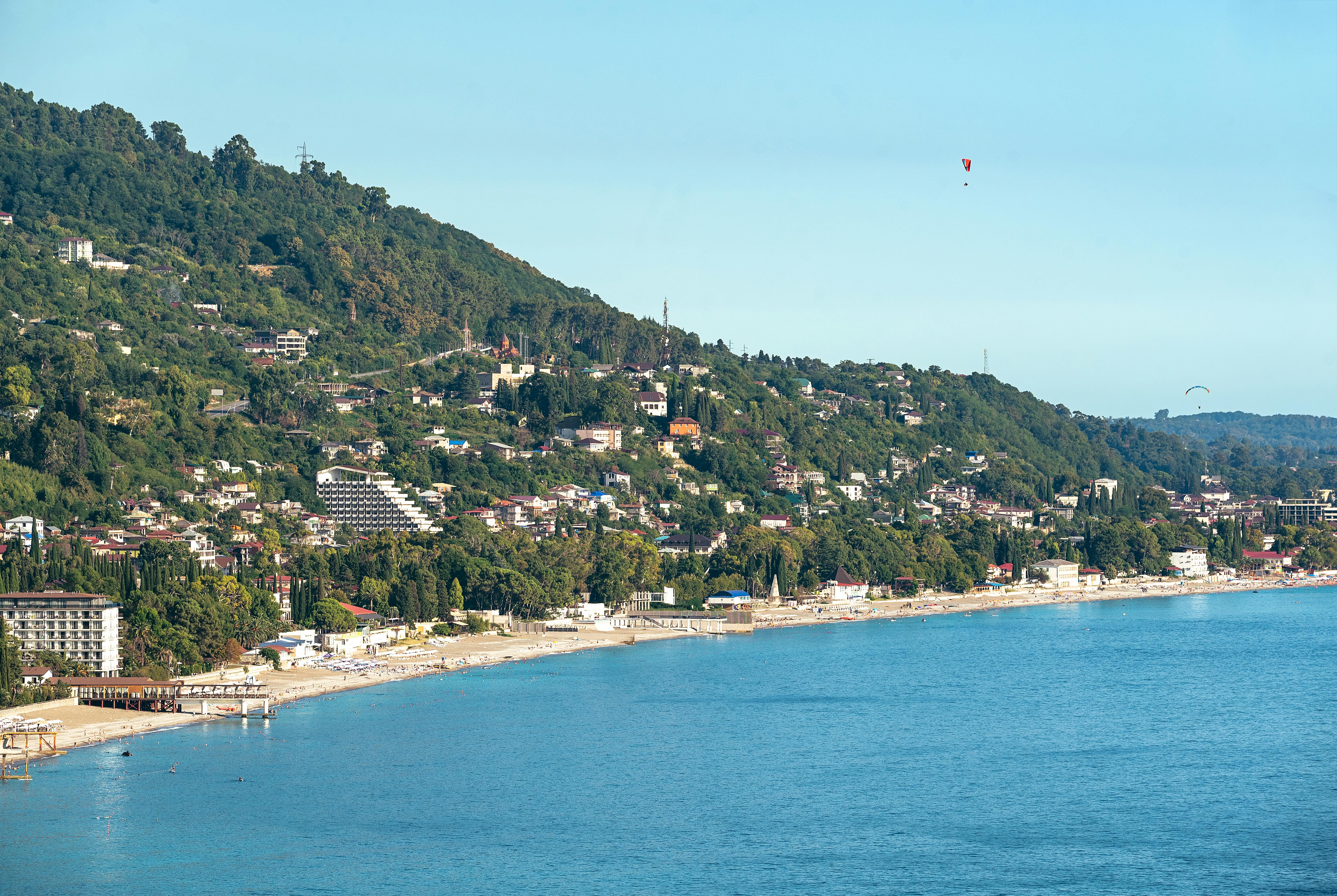 a view of a beach and a city from a hill