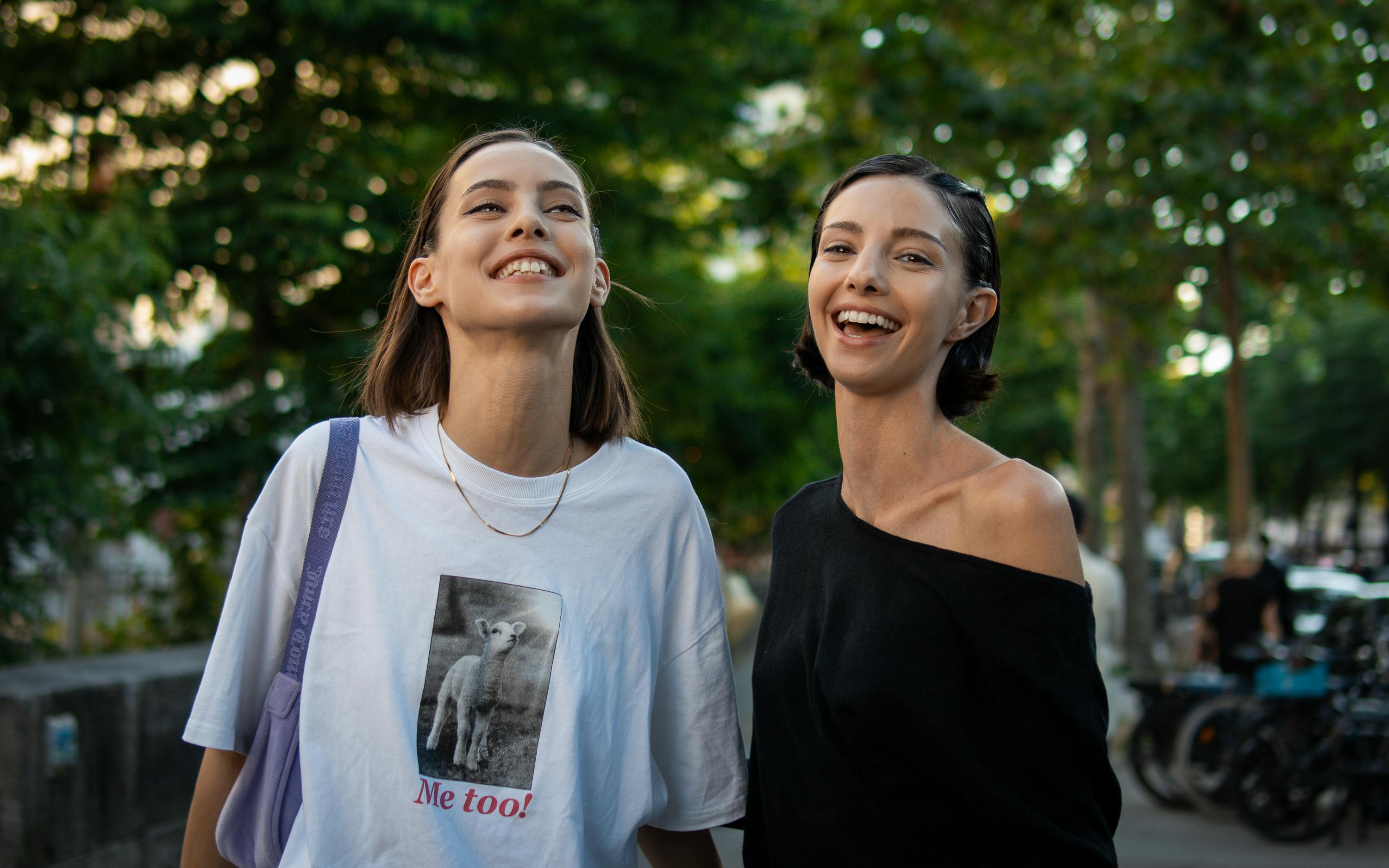 joyful friends smiling outdoors in paris