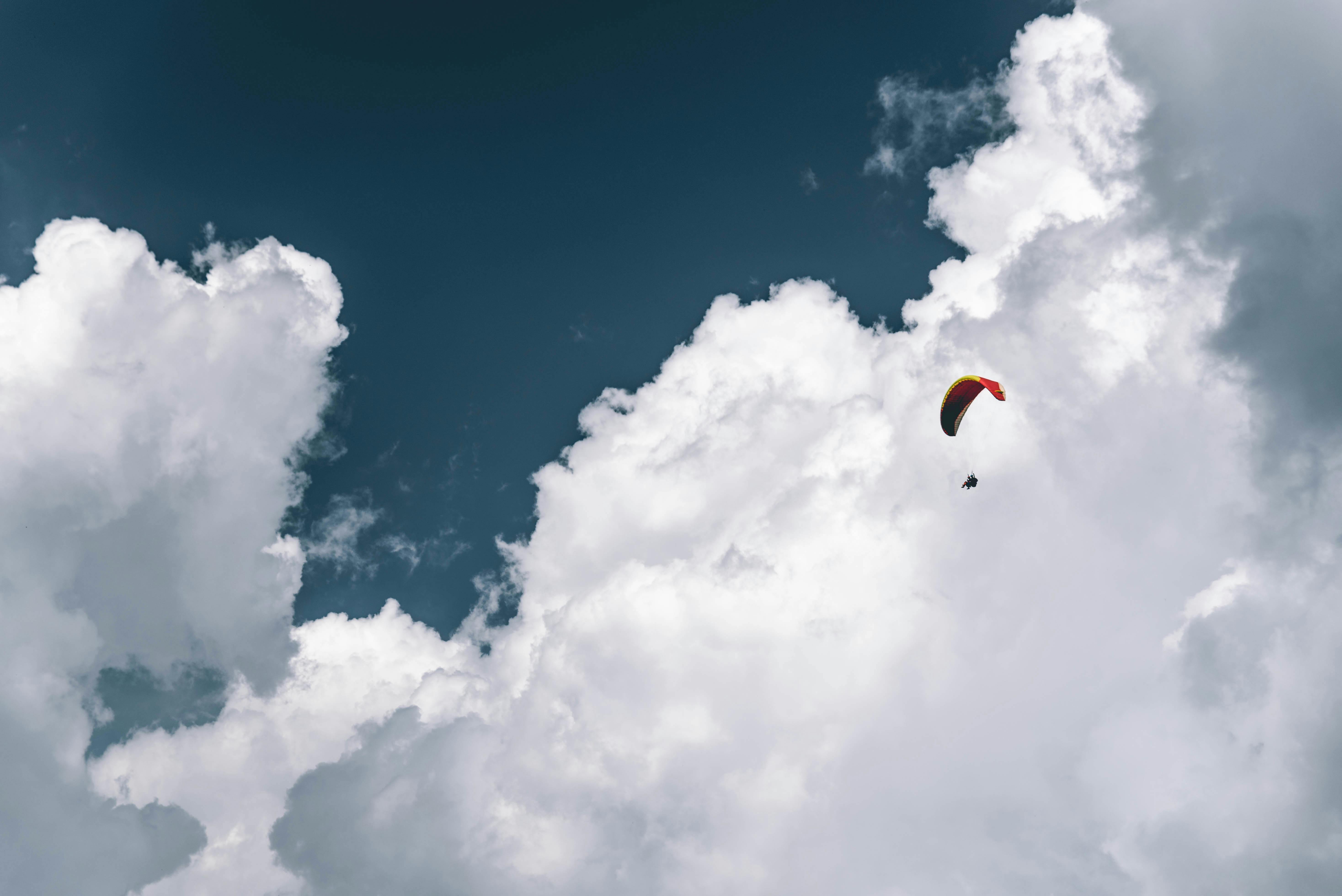 photo of person paragliding