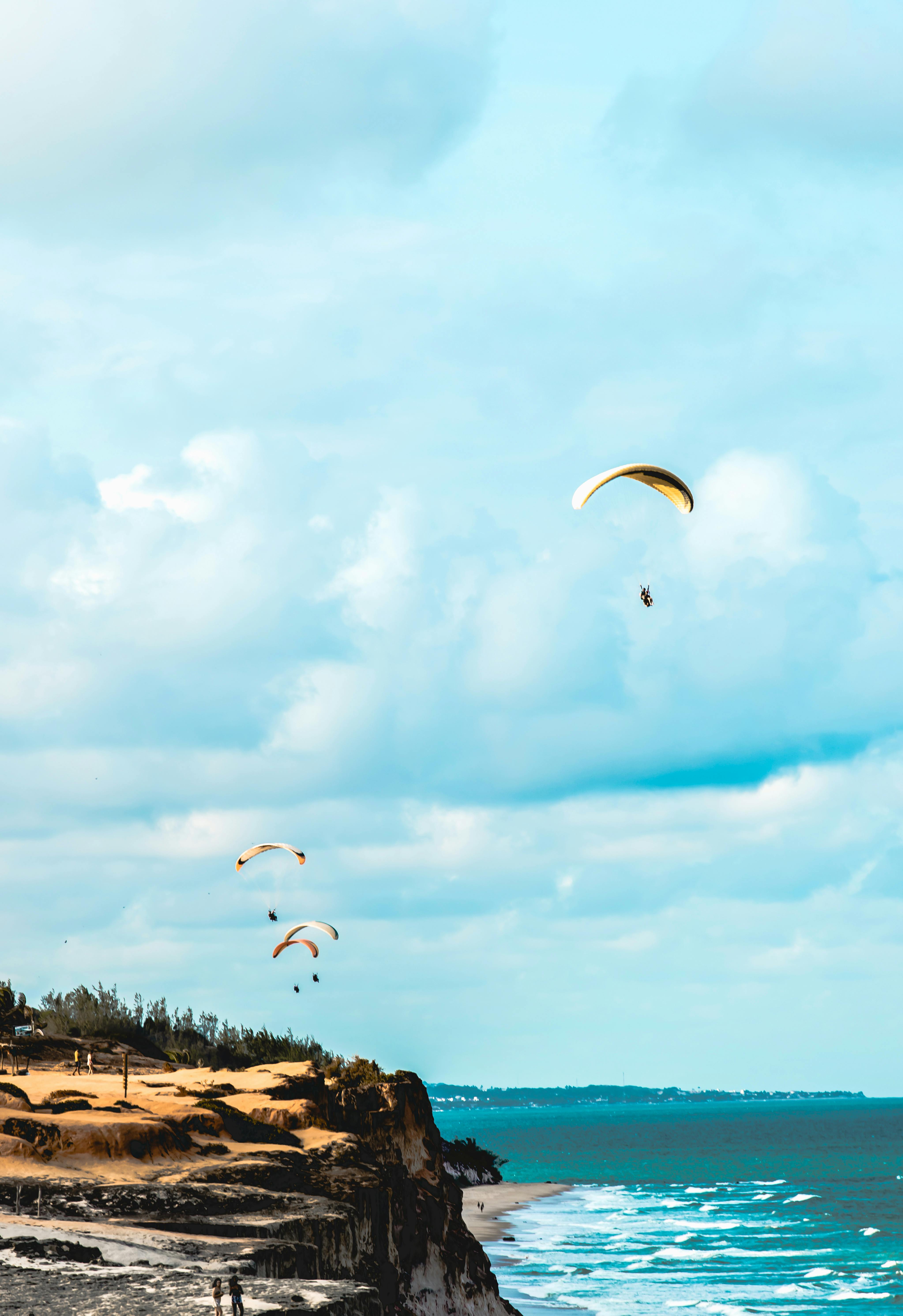 photo of paragliders on air