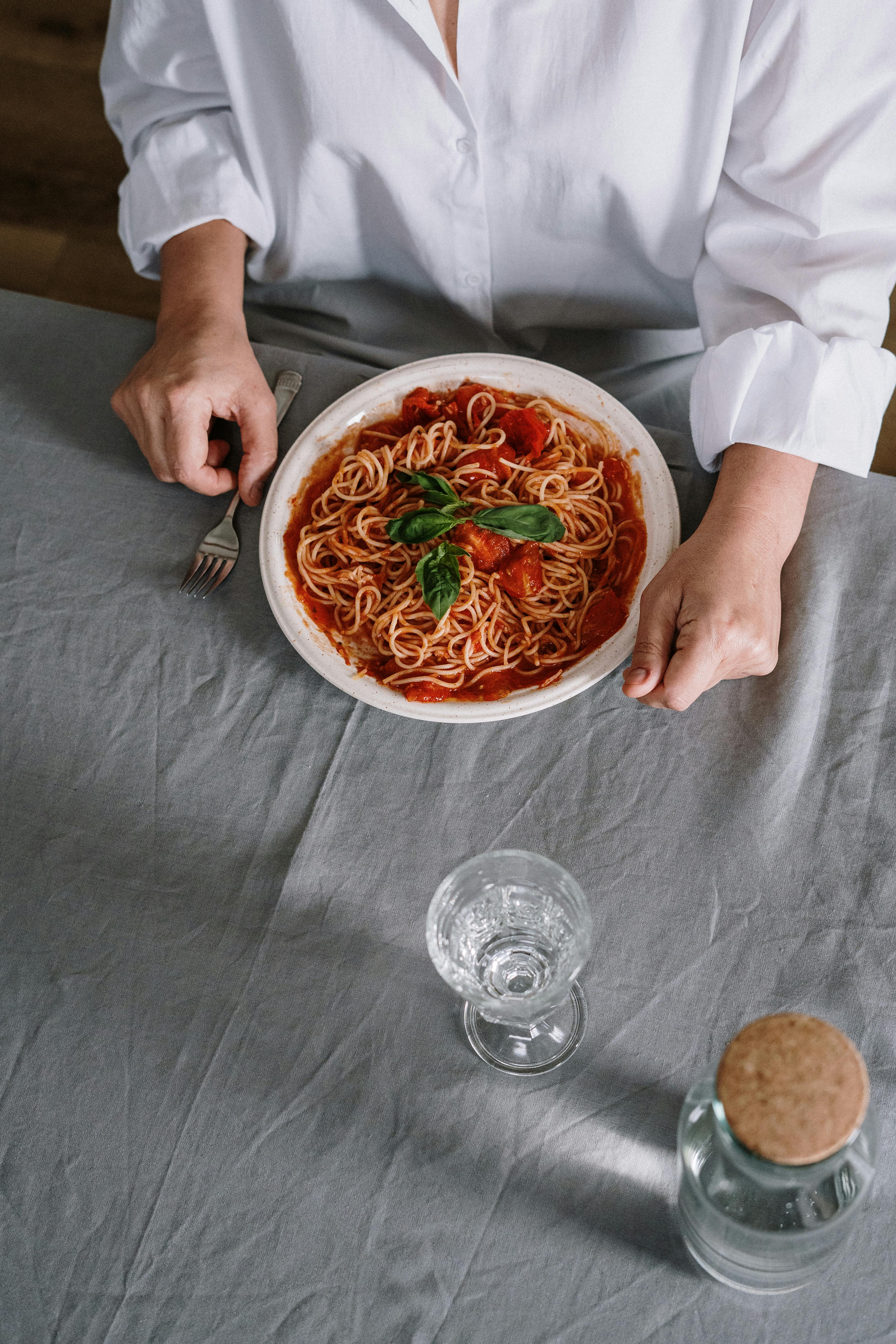 a plate of spaghetti on table