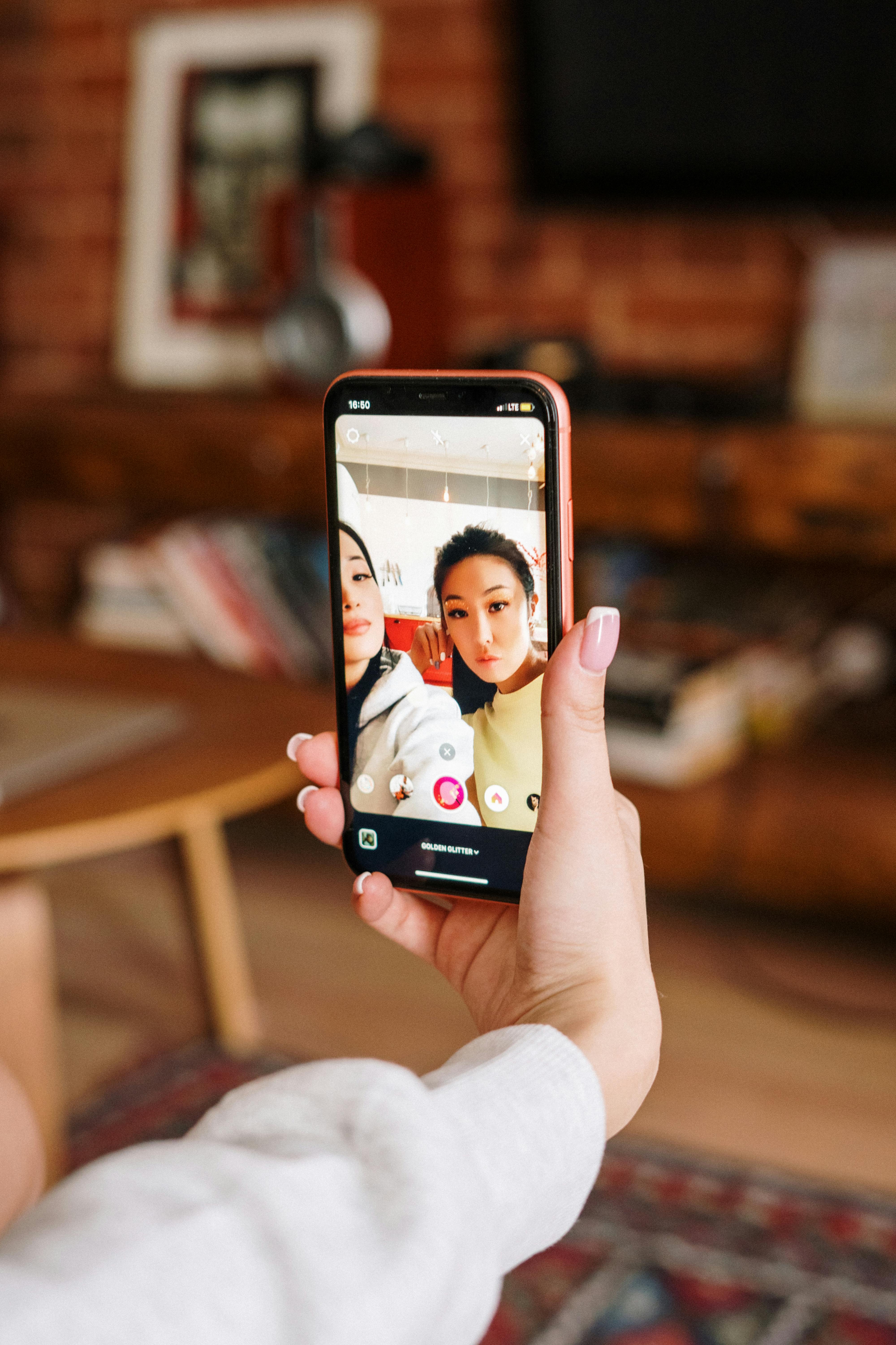 person holding black iphone