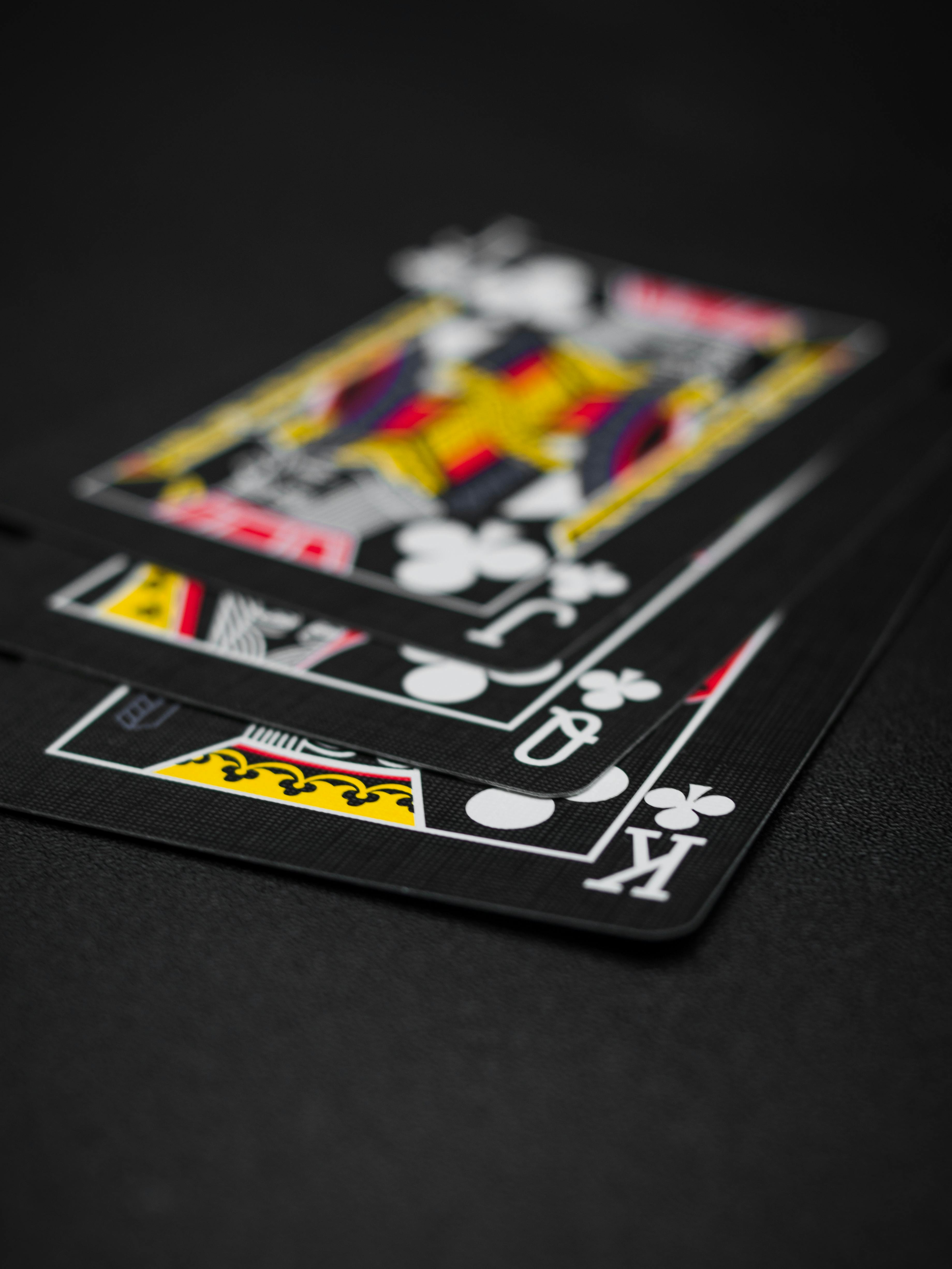 black playing cards on black background