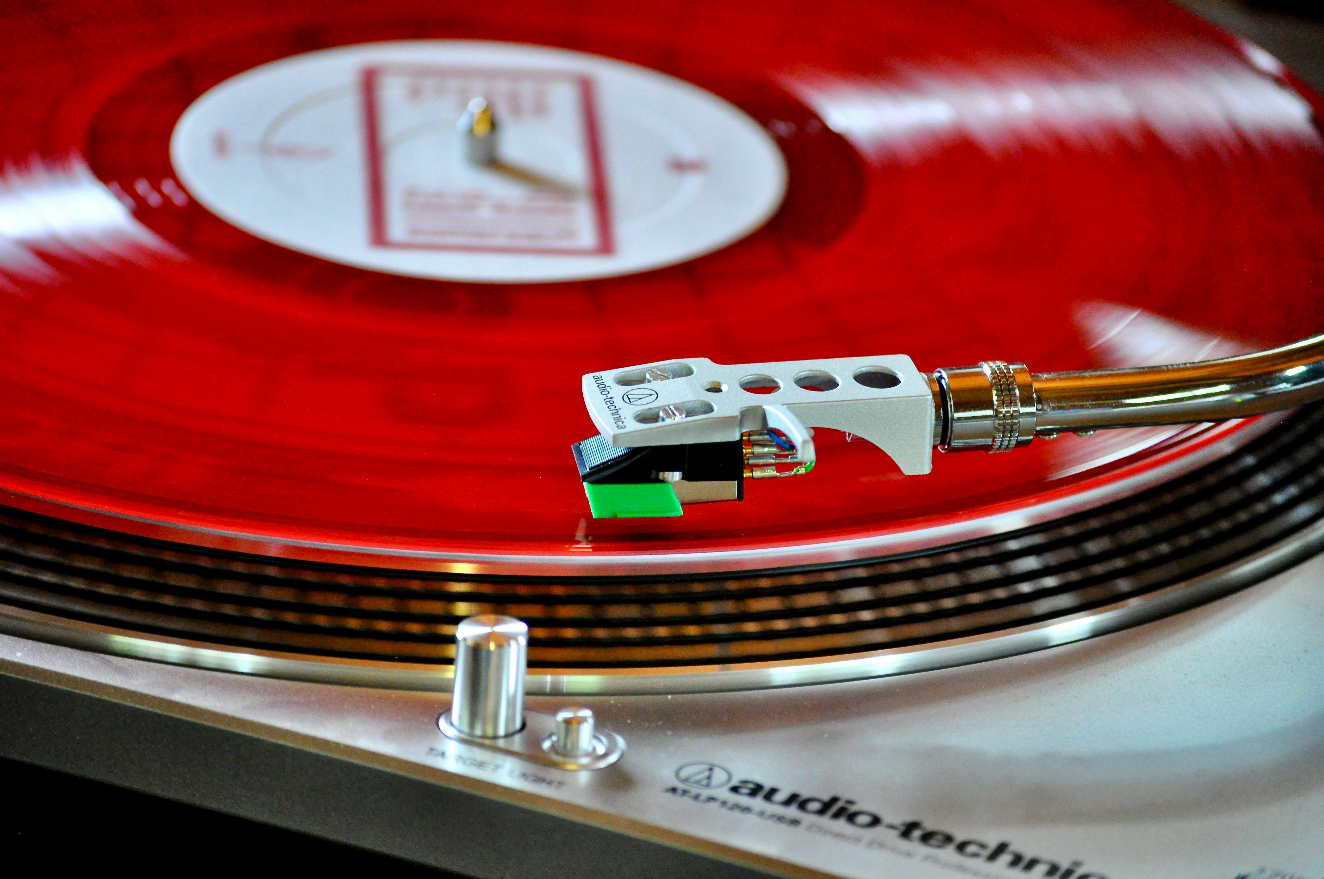 close up photo of red vinyl record