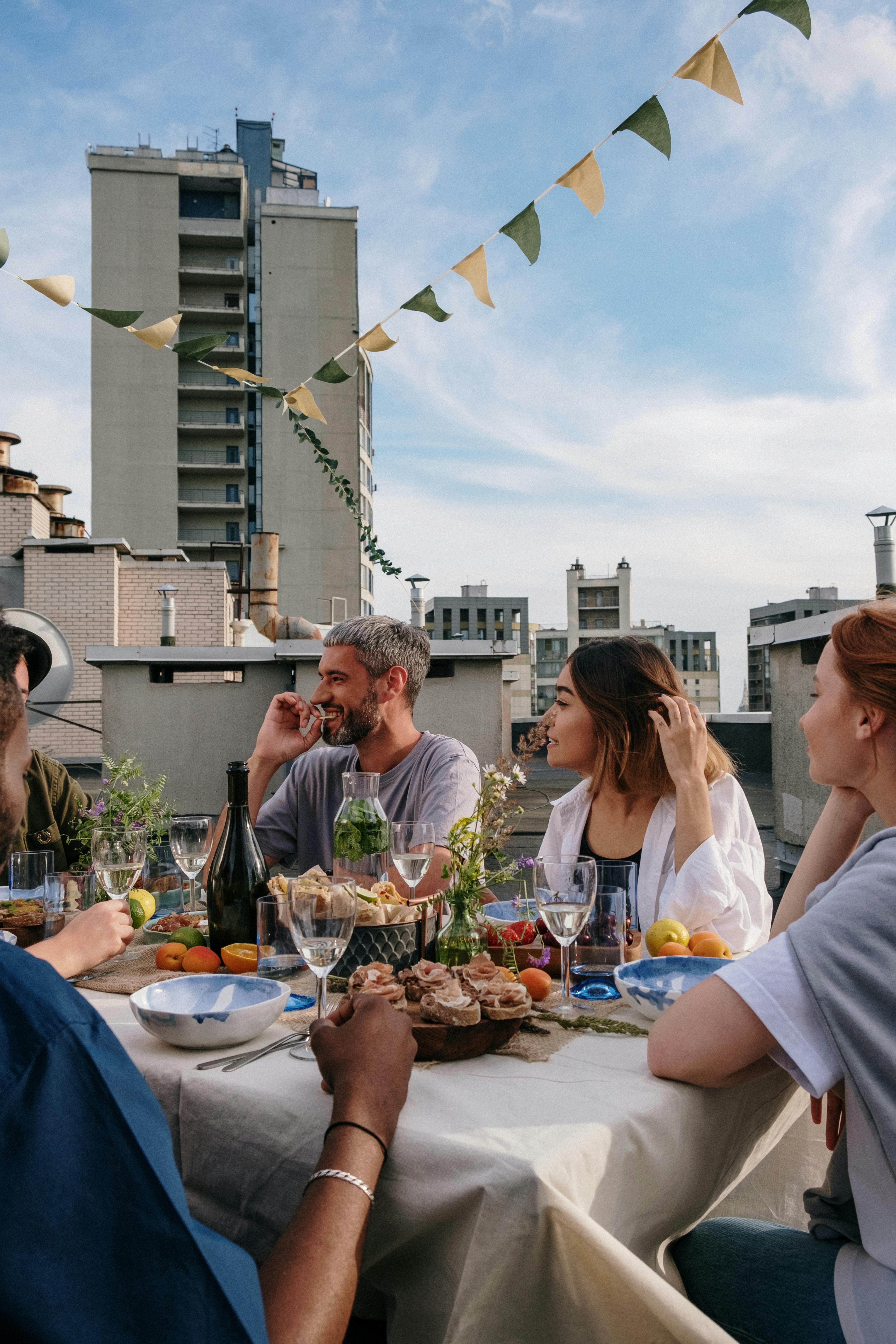 people sitting on chair in front of table with foods