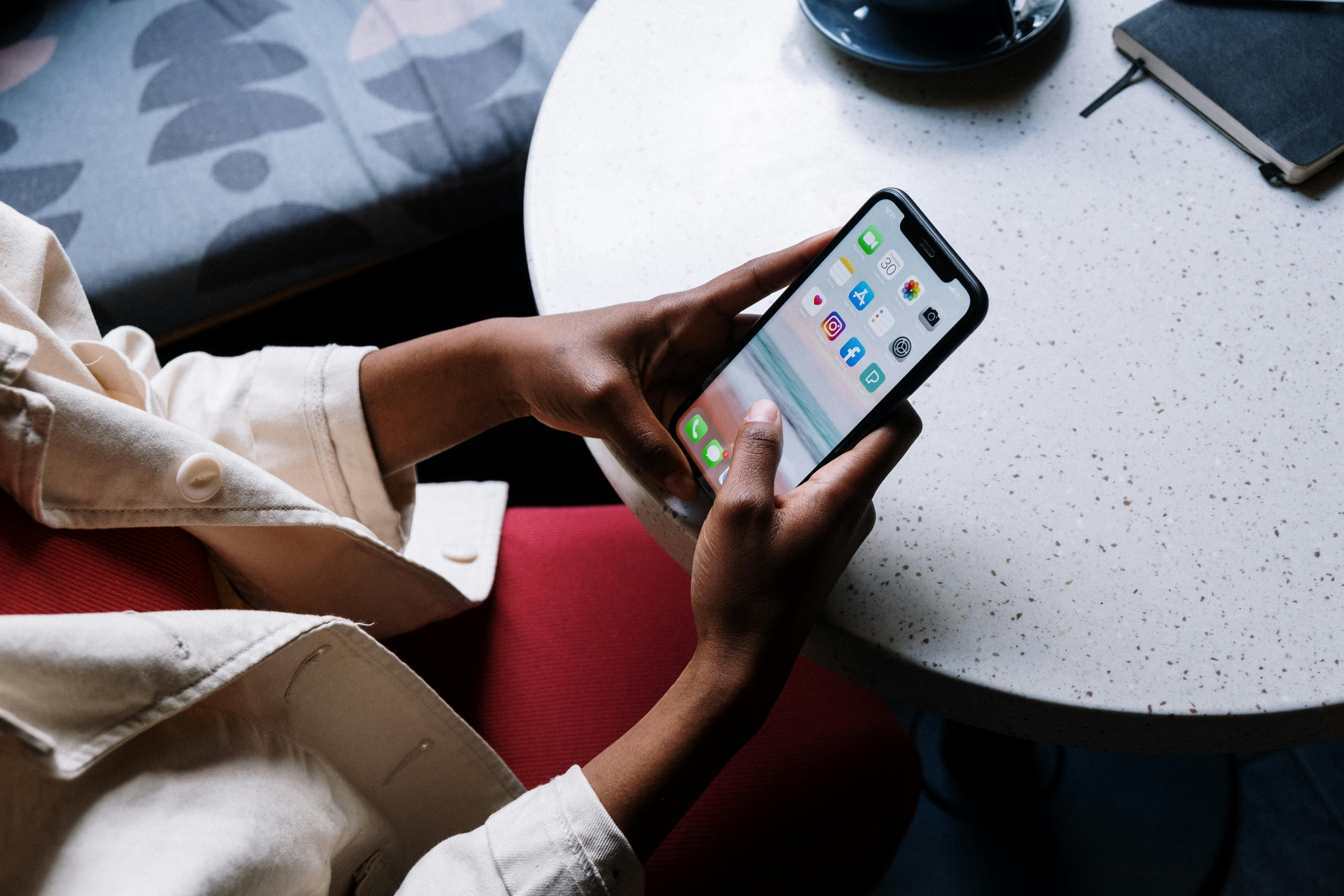 person holding black iphone