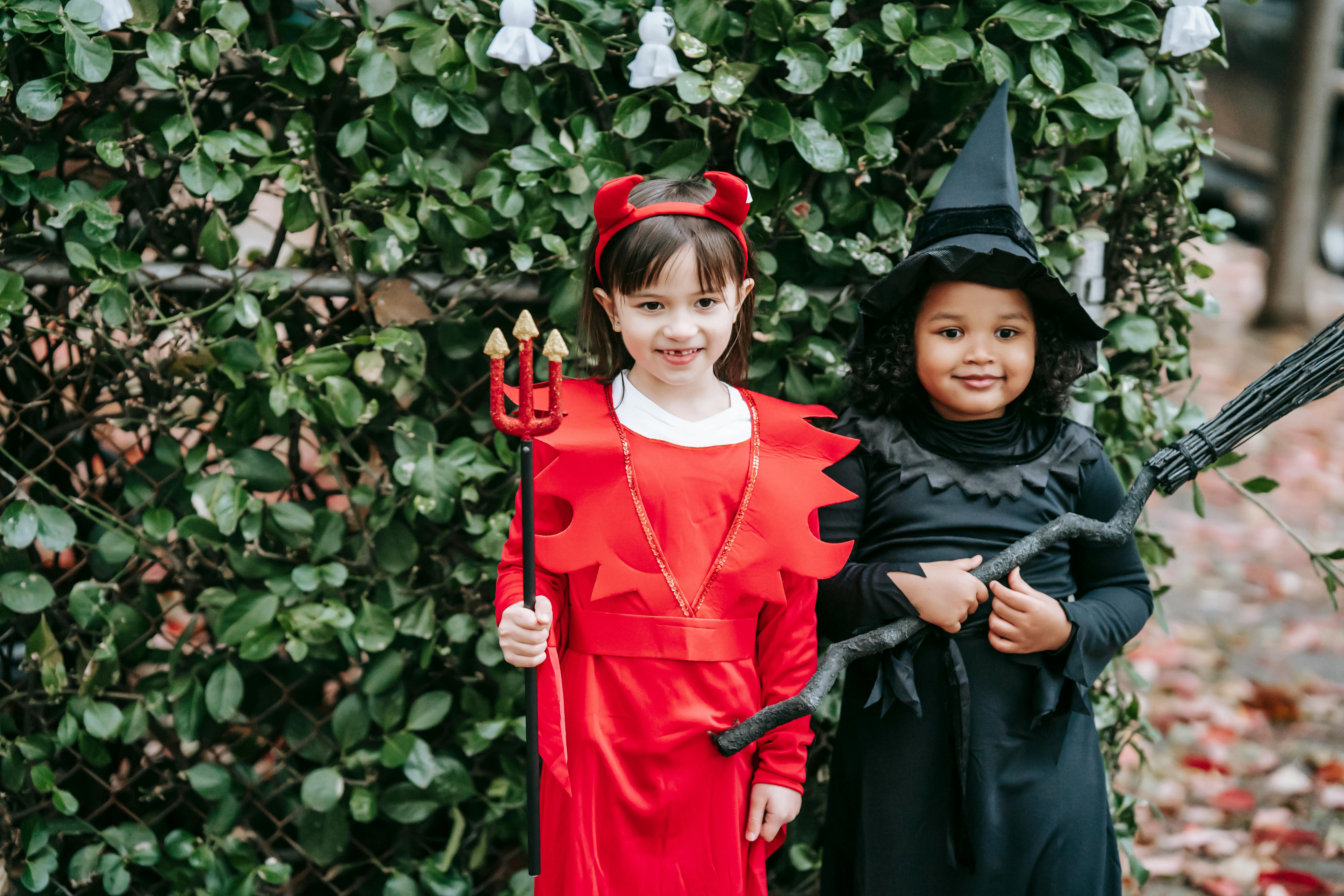 cute multiracial girls in halloween costumes