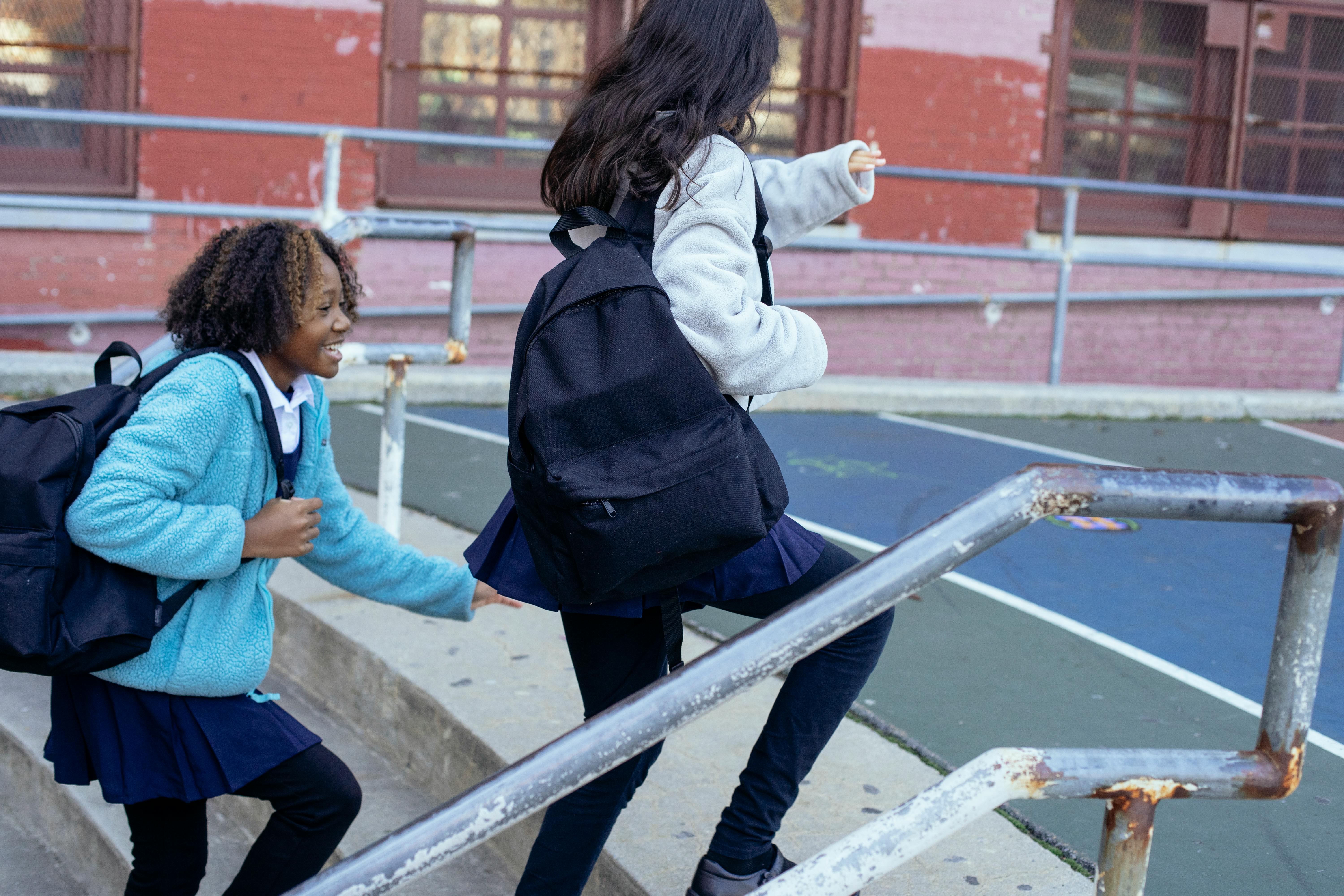 cheerful girl hurrying to school