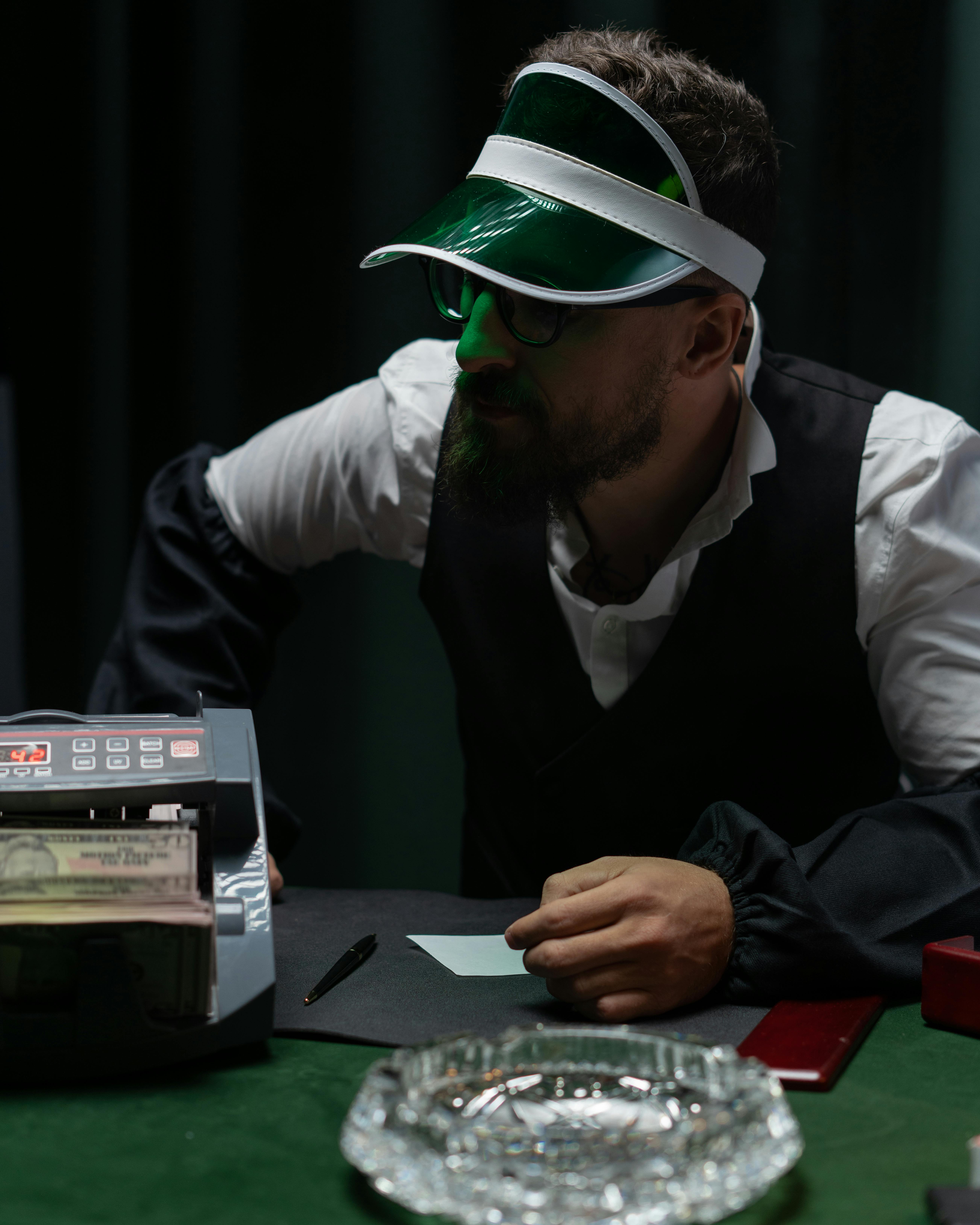 gambler wearing green cap