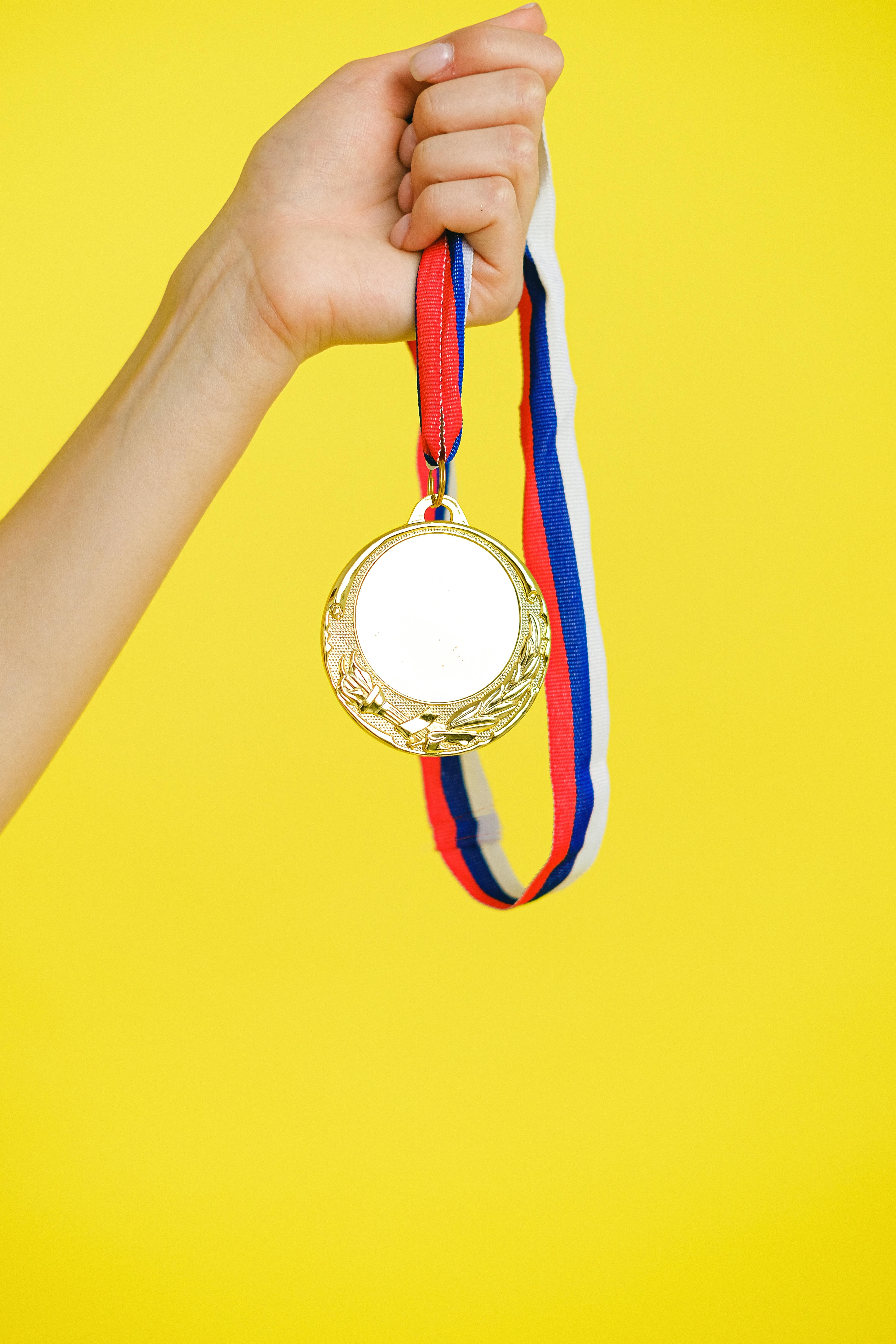 a person holding a medal