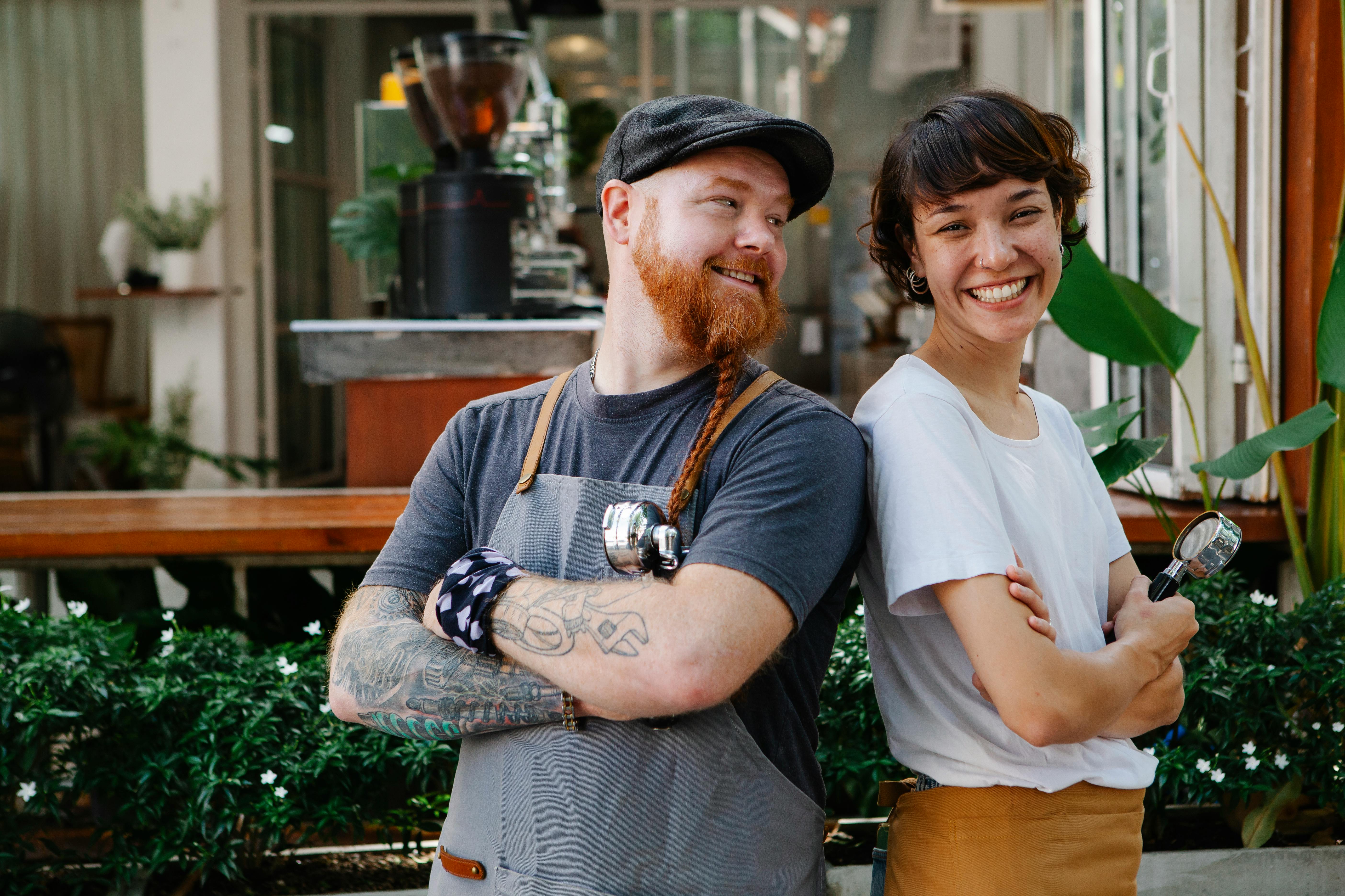 couple of colleagues spending time near cafe in street