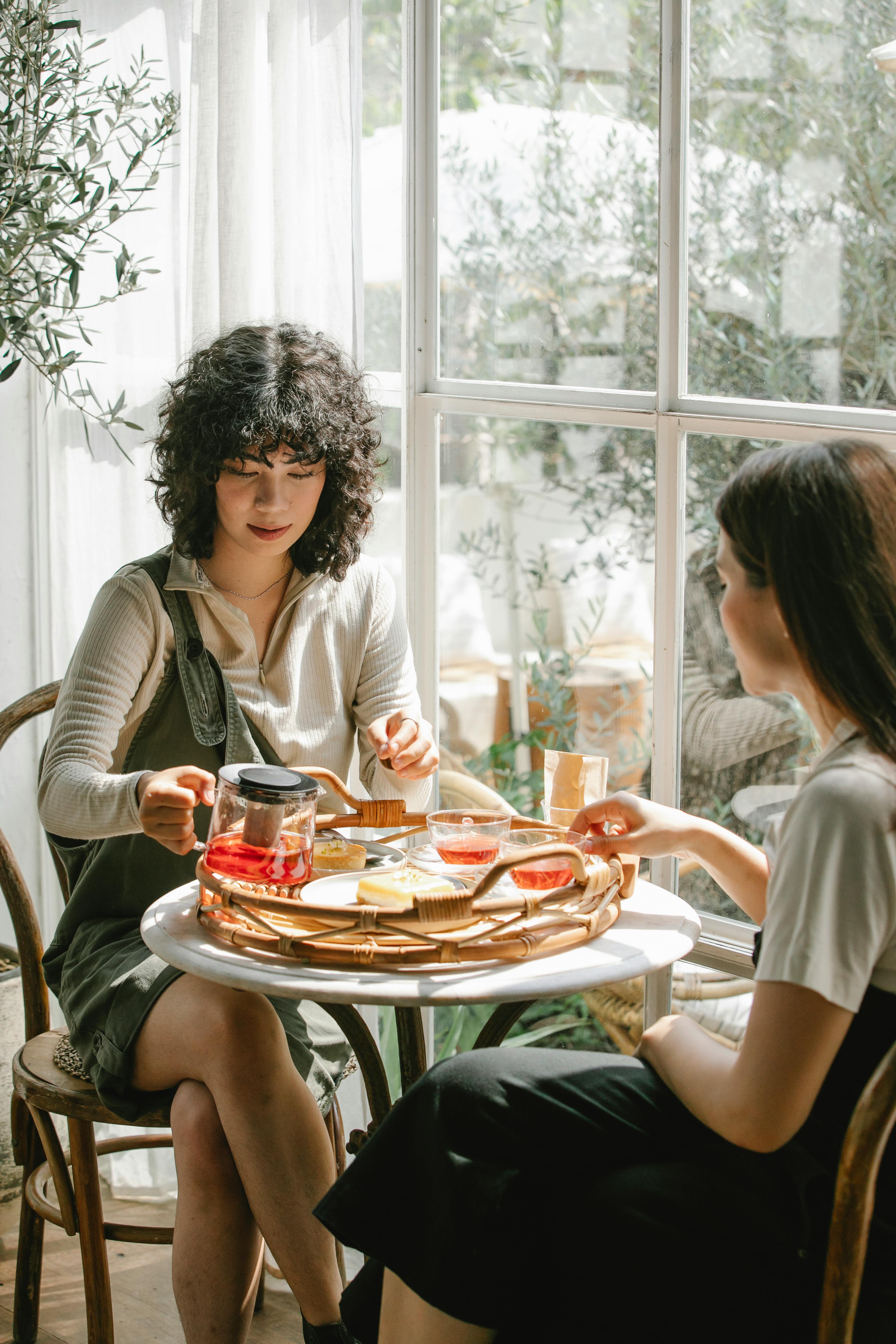 diverse female colleagues having breakfast together