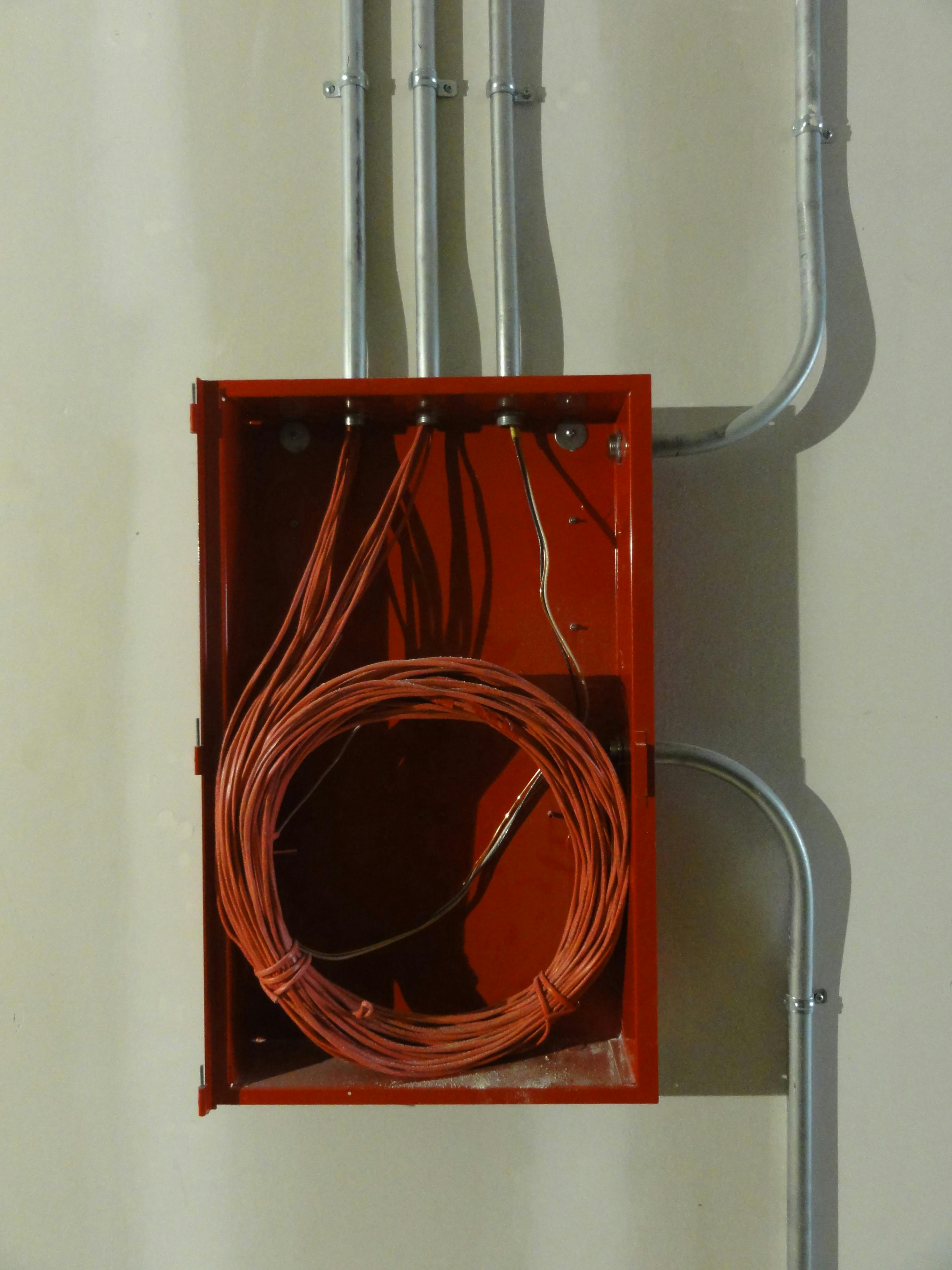 a red rolled wires in a red box