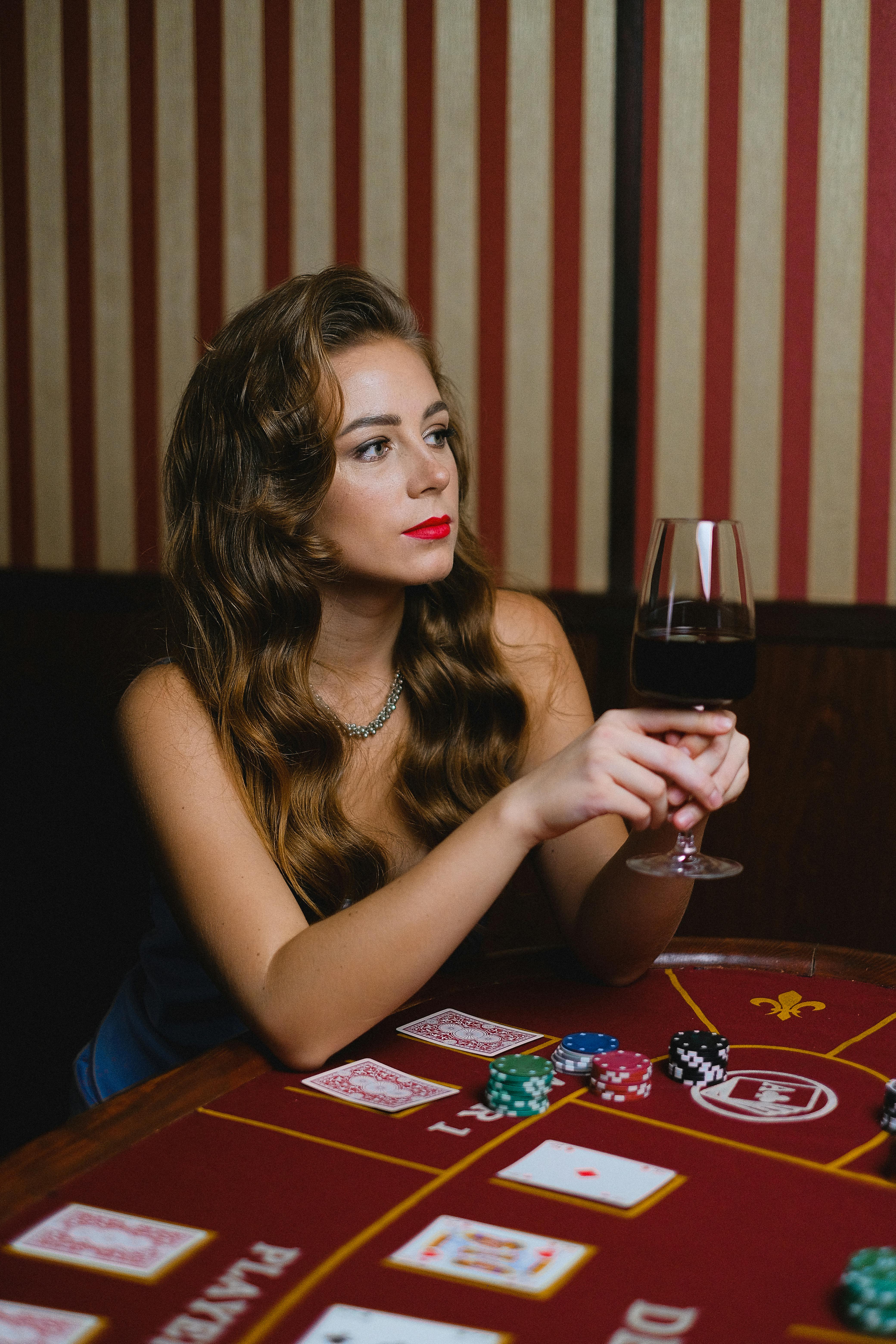 a woman holding a glass of wine