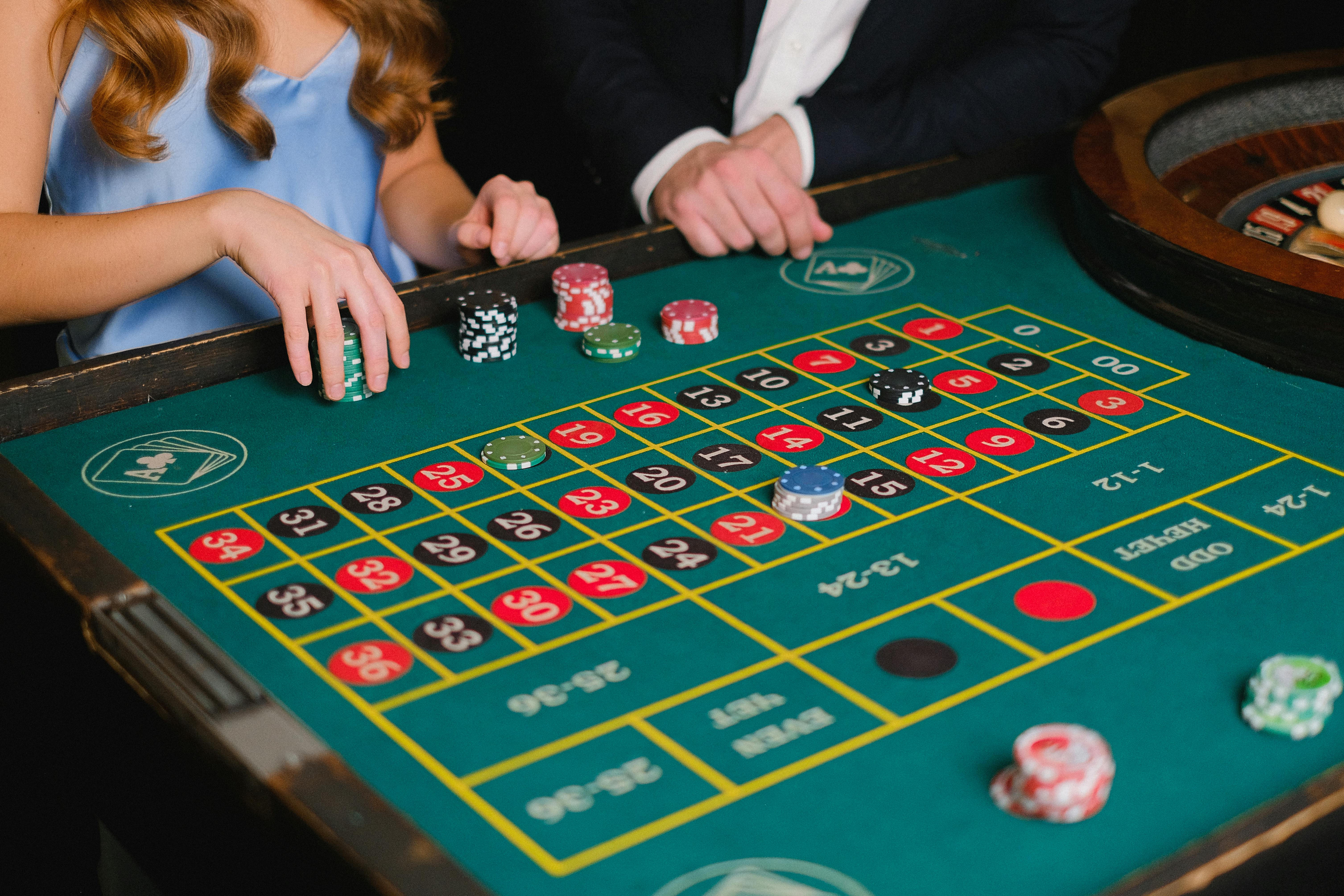 a person holding casino chips