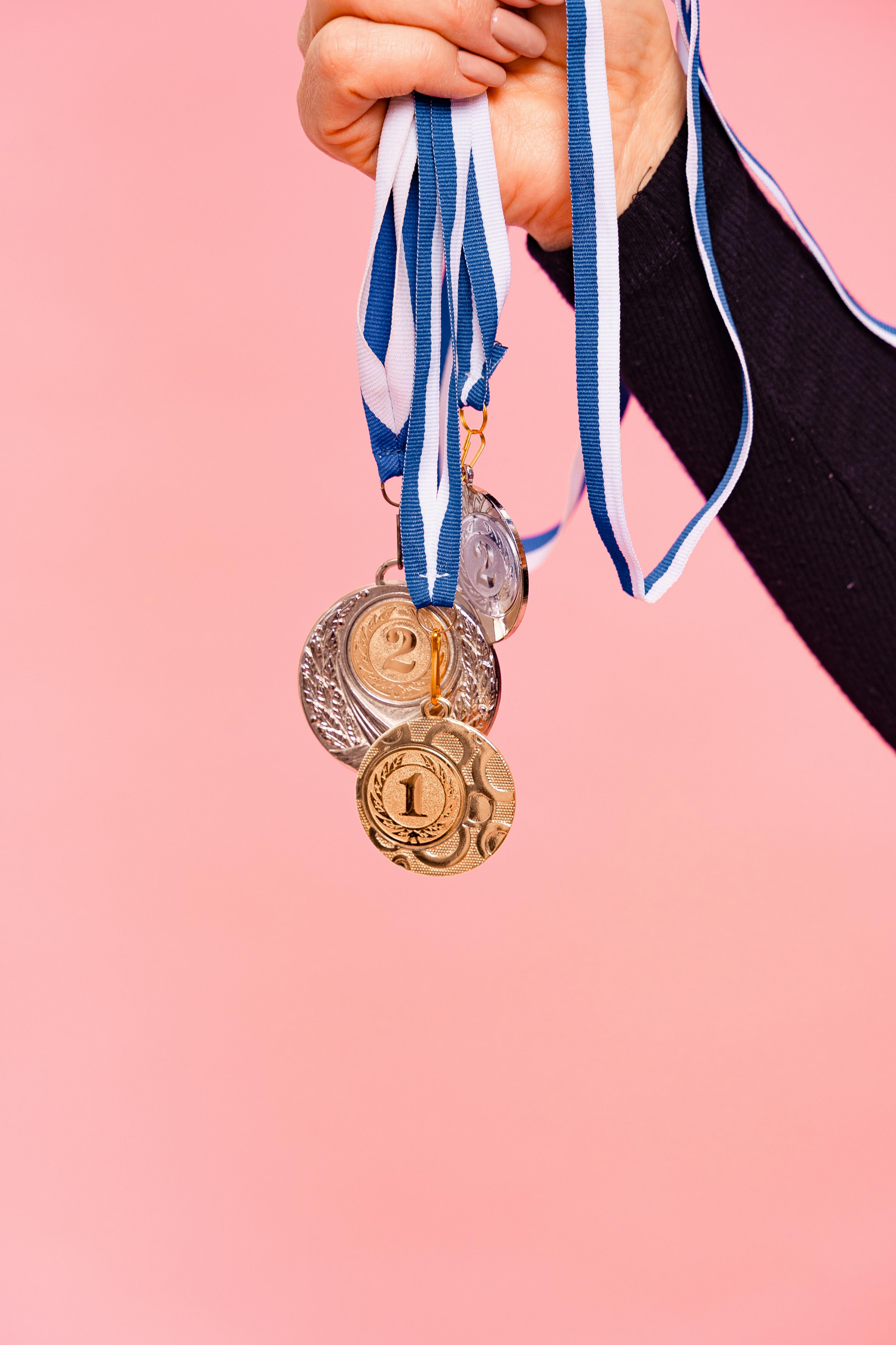 a person holding medals