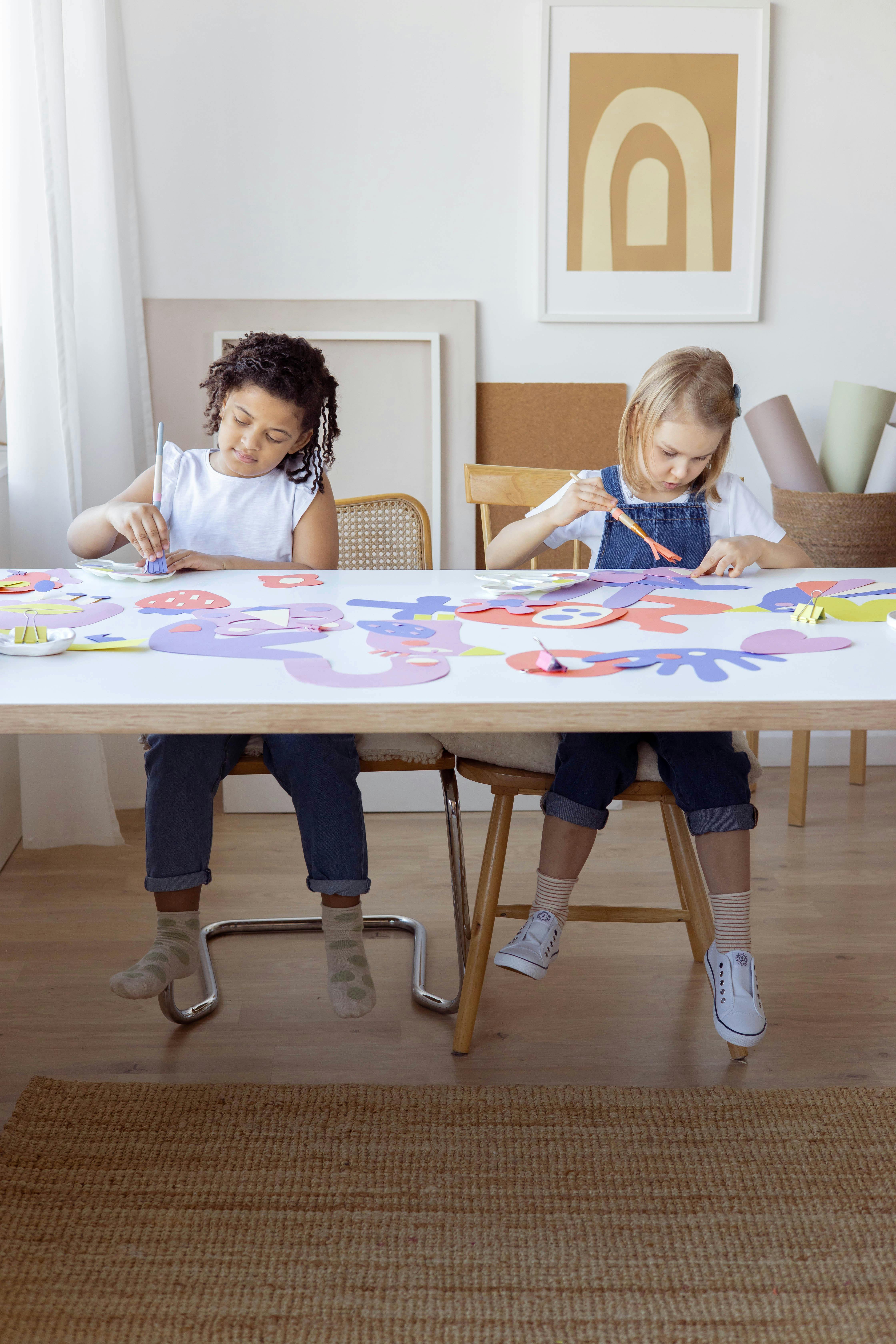 two kids doing some artworks