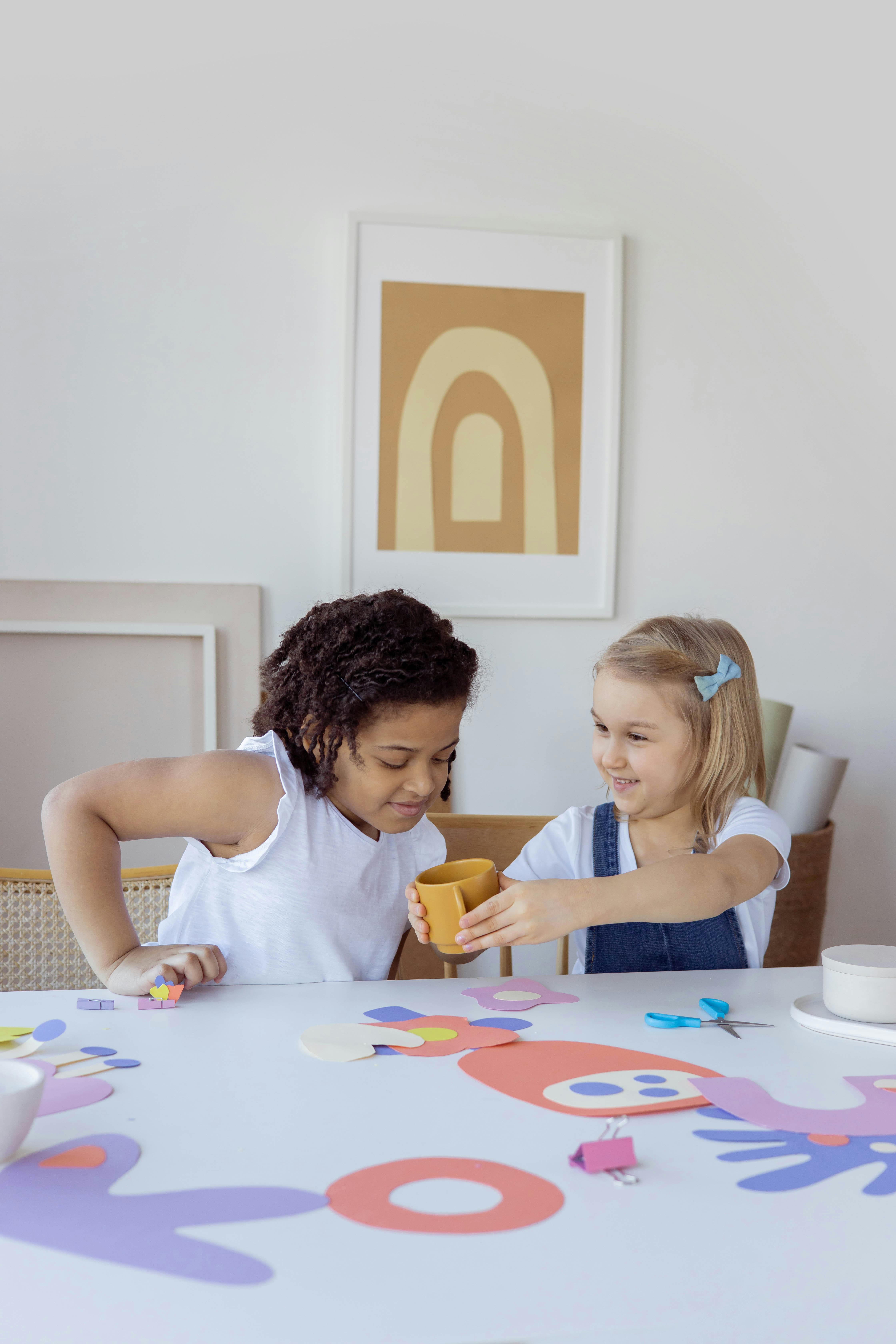 two kids doing some artworks