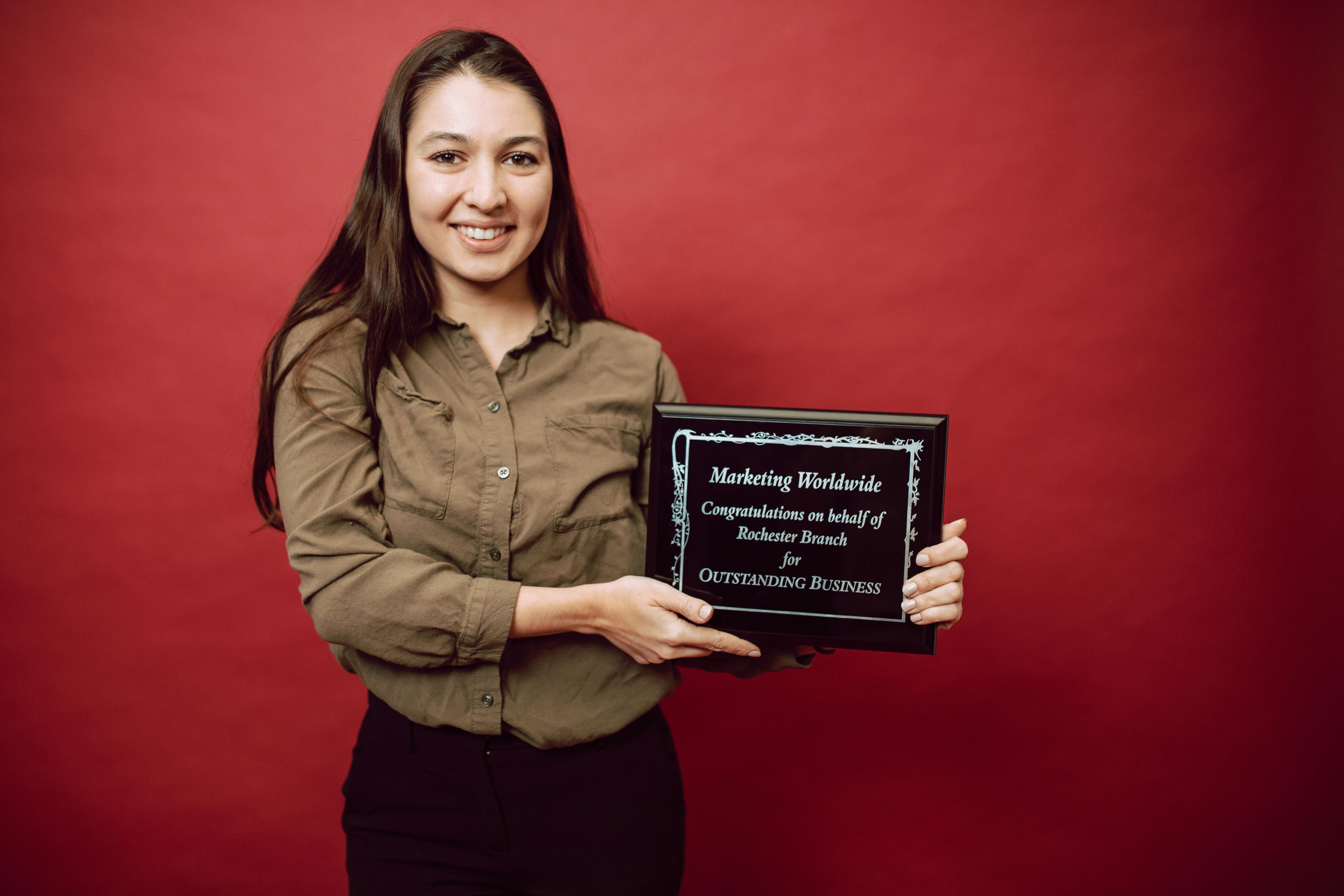 a businesswoman receiving a recognition award