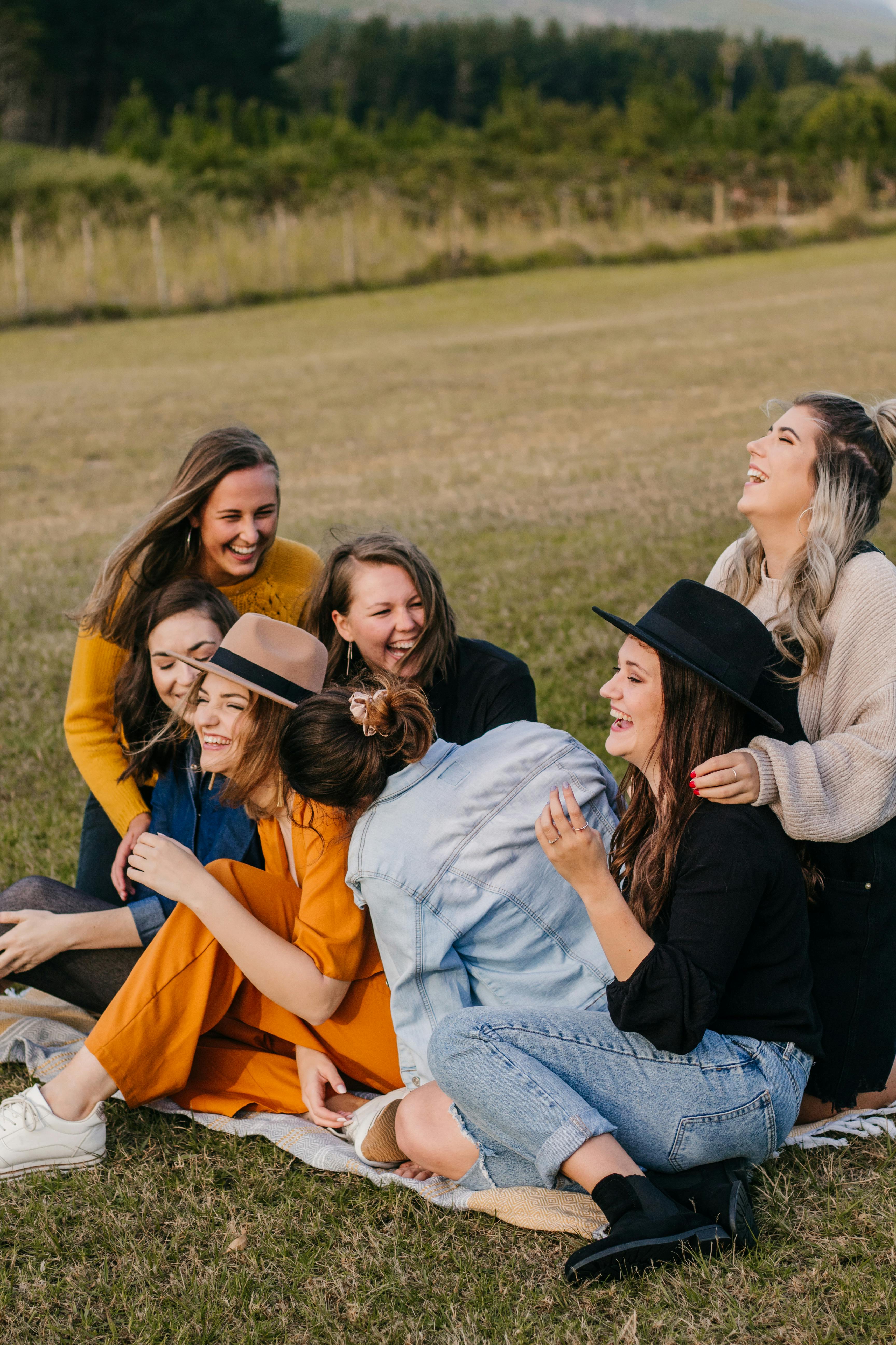 laughing friends having fun on picnic