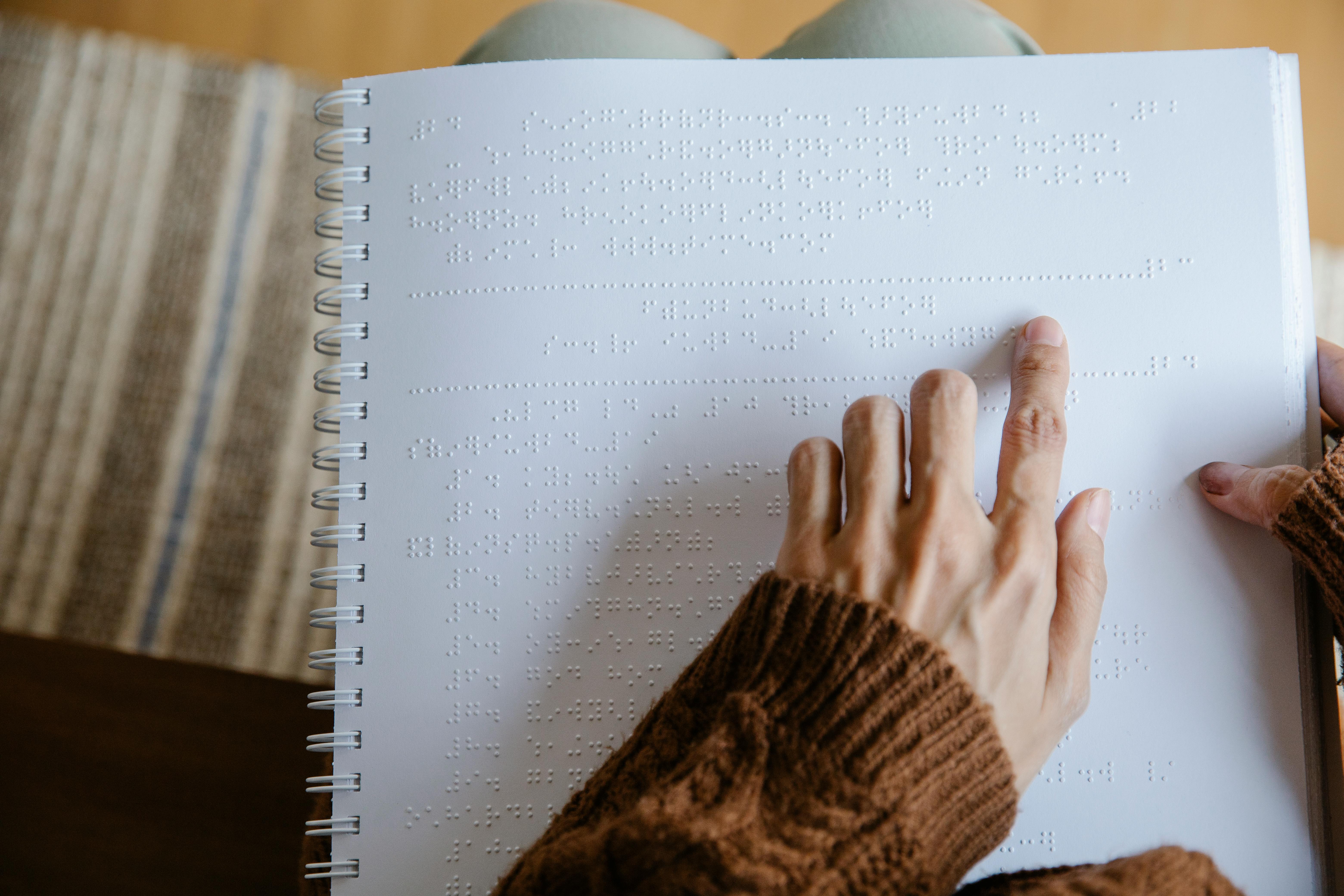 photo of person using white braille paper