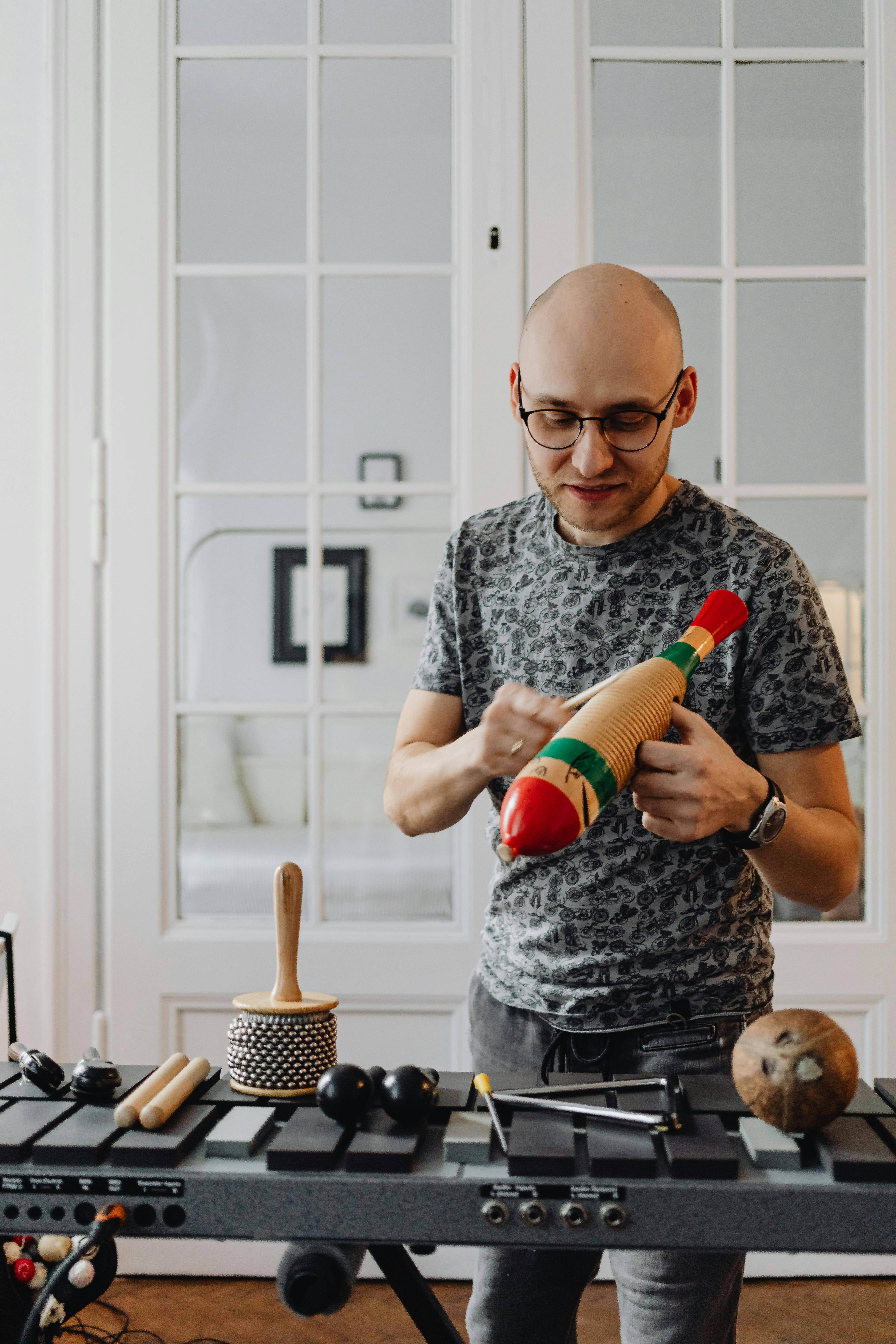 a man holding a guiro