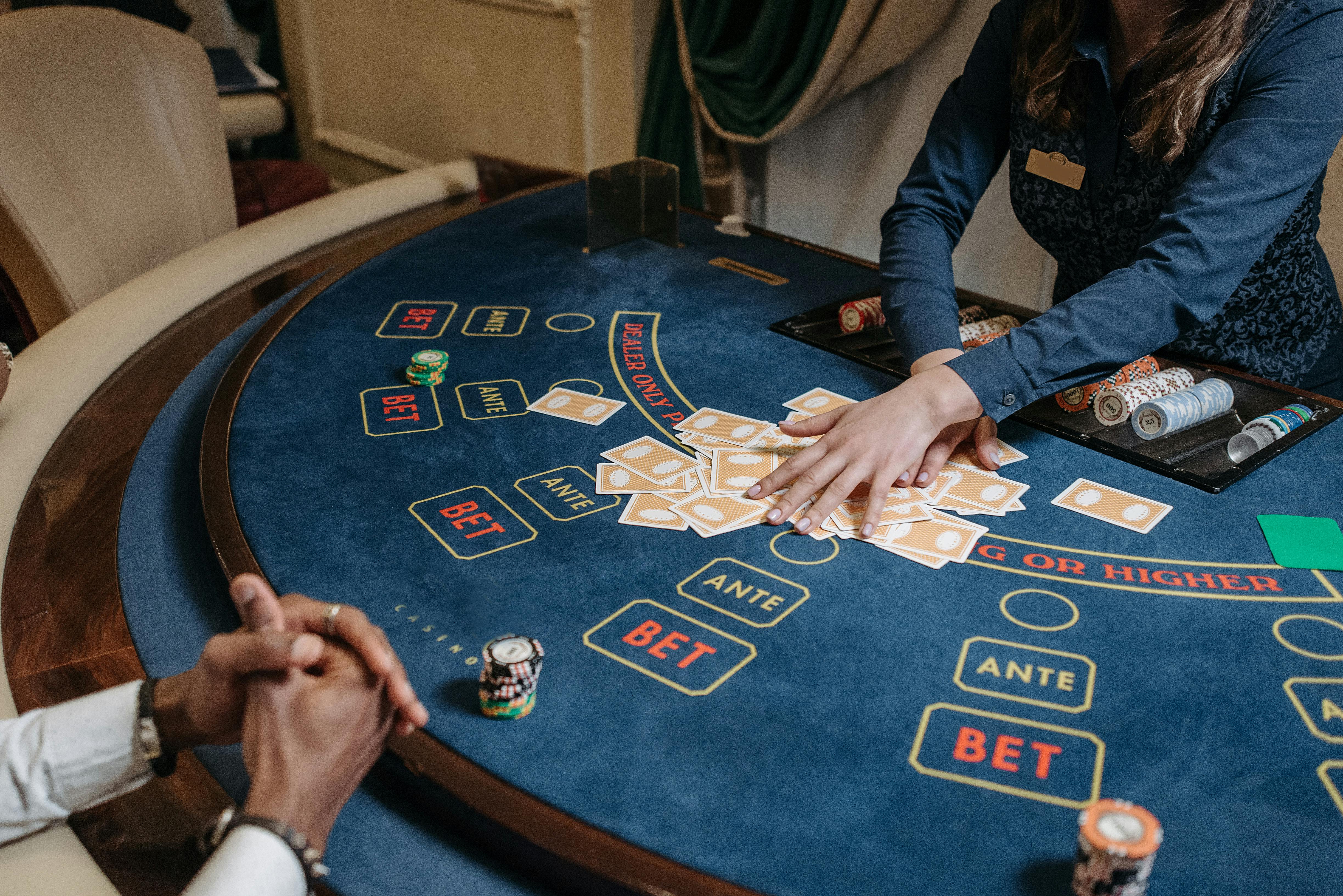 a woman dealer holding cards