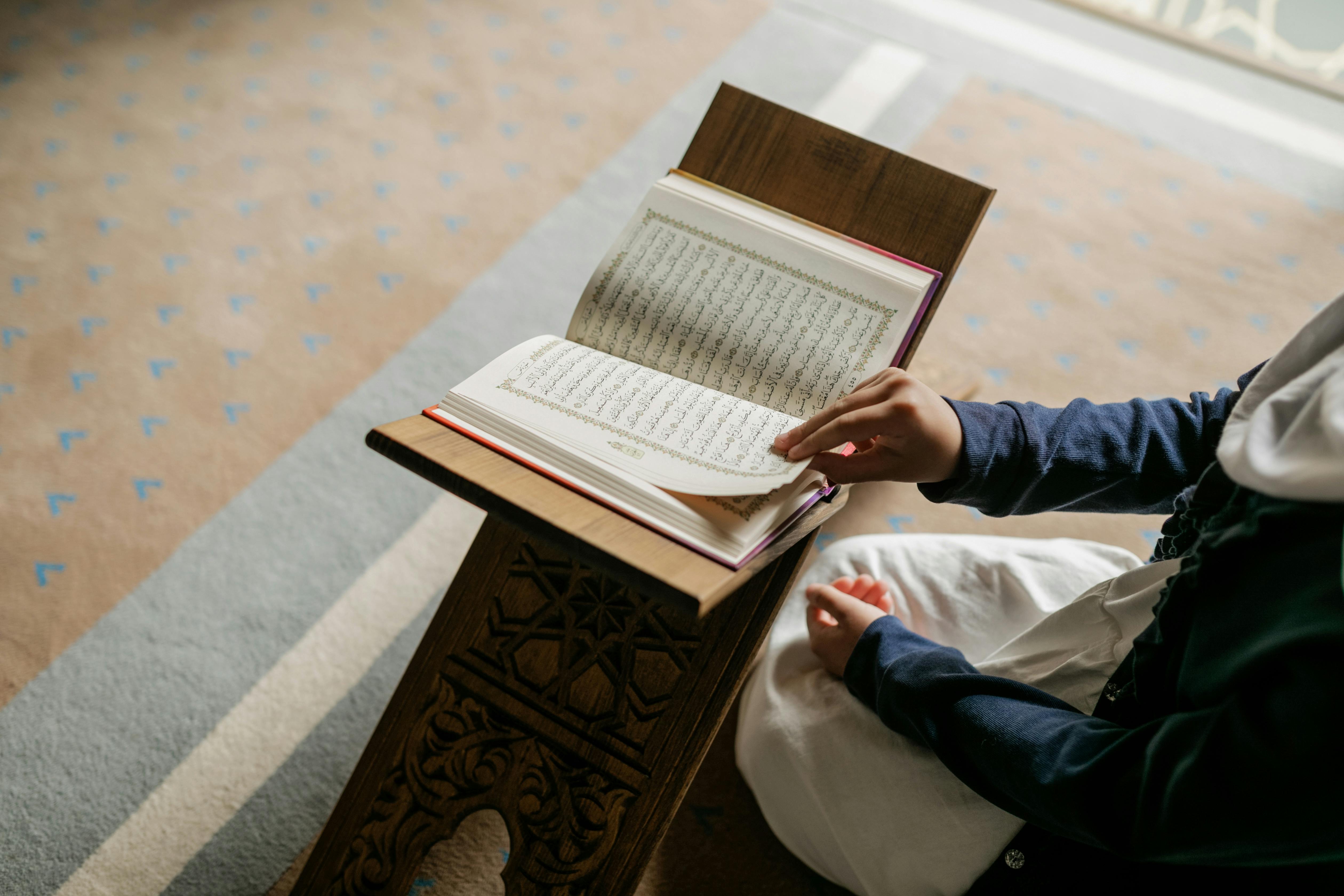 reading the koran on the stand